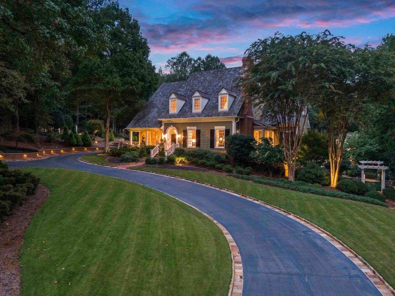 Casual Elegance Meets Custom Sophistication on SPECTACULAR and private 2.7 acre paradise in one of Milton Ga’s most desired and prestigious neighborhoods- North Valley- boasting award winning schools and recognized as an area for the highest quality of lifestyle in Ga. In close proximity to Downtown Alpharetta with shopping, dining and entertainment venues. Artfully landscaped and designed homesite lures you in via a Crab Orchard rock lined driveway to carriage house and through Porte-cochere to carport. Garage spaces will house 7 vehicles. Custom designed residence offers timeless appeal, unsurpassed craftmanship and unique and appealing architectural touches. Lavish upgrades include beautiful custom cabinetry, gleaming hardwood flooring, imported tile, all outdoor decking is IPE (exotic hardwood), outdoor lighting including bell lighting. Large Pool cabana with grilling station and luxurious Pebble Tech pool with hot tub featuring double waterfalls. Stepping into the main entrance of the residence you will notice gleaming hardwood flooring, extensive molding and timeless style to the design. Invite Grace and Style to your next dinner party in the formal dining room with fireplace or have a large family gathering. Formal parlor adjoins a gentleman’s office. The heartbeat of the home will be the open kitchen with enormous center island, adjoining a fireside family room and large breakfast room with access to deck overlooking pool and private grounds. Breakfast room stairs lead up to a 1940’s vintage style theatre and full bath. Back on the main level there is an oversized laundry facility with an abundance of storage. The owner’s suite on the main level boasts a second fireplace and adjoins a spa inspired bath and large closet. You may enjoy your deck and pool view from this retreat as well. The upper level is complete with 4 generously sized bedrooms, 2 full baths and walk-in closets. Wide hallways overlook open staircase. Terrace level is complete with 2nd family room featuring stone fireplace, oversized game room, flex room, full bath and soundproof room. You may access the pool area from this level as well. The pool and rear acreage is a masterpiece on its own, with manicured and lighted pathways and sound system surrounding the acreage. The carriage house boasts a large room, full bath and plenty of storage with character in all the details. Owner has replaced any needed outdoor trim, post and moldings with maintenance free material. You truly will not find any other home in this area that offers all the entertaining and tasteful custom features. Proof of funds required or qualification letter to secure appointment. Attention to detail and pride of ownership is evident.