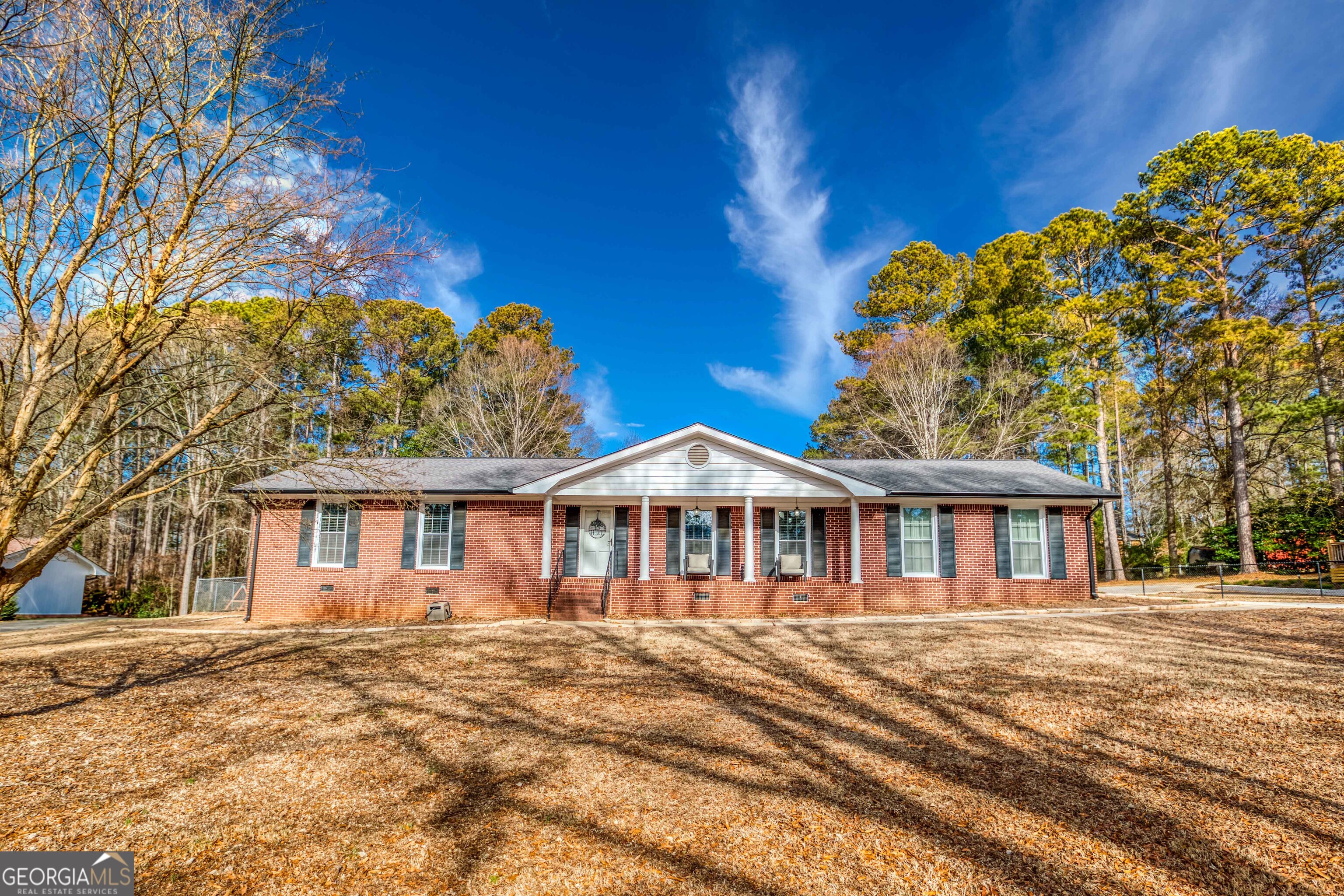 Welcome Home! Unwind and appreciate this beautifully renovated, four-sided brick open-concept residence! Every detail has been carefully considered in this luminous living area, filled with abundant natural light. Step outside to your private, covered back porch, where you can enjoy coffee and savor tranquil moments on your delightful bed swing. The fully upgraded kitchen features a double oven and a vegetable sink, perfect for all your cooking adventures, elegantly complemented by stunning quartz countertops. And don't forget your golf cart-it's just a quick drive to Downtown Monroe!