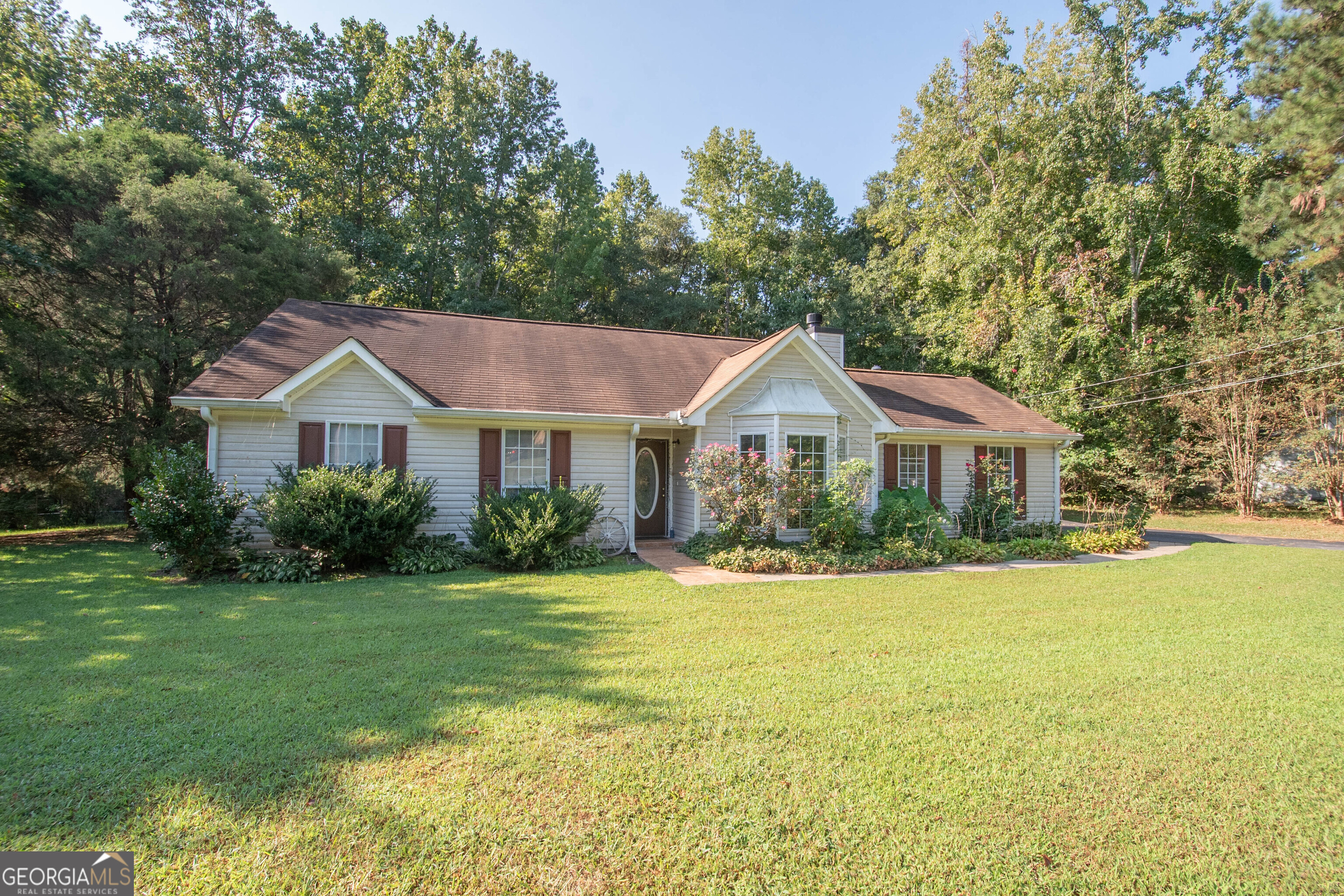 WELCOME to this ranch style home. The home offers Great Room with fireplace, kitchen with dining area, three bedrooms and two baths. Double-side entry garage, covered rear patio and screened porch. Recently: poly pipes replaced and roof was replaced/repaired. NOTE: This is an investor owned property; NO DISCLOSURE; sold strictly AS-IS. Very good value. Call agent for any questions: Dave 770-241-9948. SEE PRIVATE REMARKS.