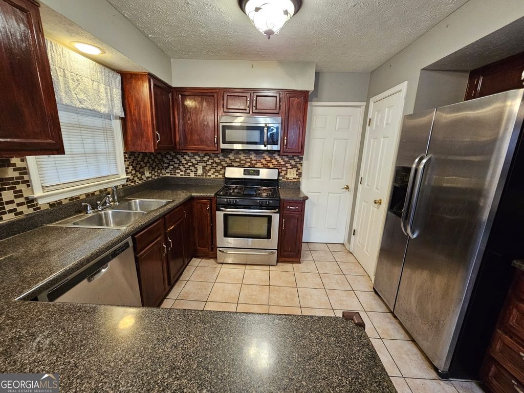 Photo of 4933 Clubgreen Summit, Stone Mountain, GA 30088 (MLS # 10625228)