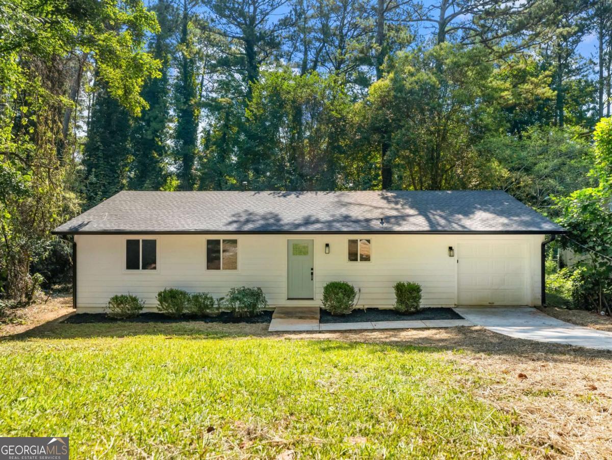 Discover modern comfort and timeless charm at 4059 Big Valley Trail, a fully renovated 4-bedroom, 2-bathroom ranch home in the heart of Stone Mountain. On a generous 0.3-acre lot, this rare single-story gem boasts a stunning open floorplan, perfect for today's lifestyle. Step inside to find brand-new luxury vinyl plank (LVP) flooring, fresh interior and exterior paint, and a state-of-the-art kitchen featuring quartz countertops, sleek stainless steel Samsung appliances, and new cabinetry. Recent upgrades include a new HVAC system, hot water heater, and roof, ensuring peace of mind for years to come. With four spacious bedrooms-a rarity in this area-this home offers flexibility for families, guests, or a home office. Nestled in a peaceful neighborhood, you're just steps from MARTA, shopping, dining, and grocery stores, with Stone Mountain Park and Covington Highway minutes away. Move-in ready and meticulously updated, this is suburban living at its finest-don't wait to make it yours!