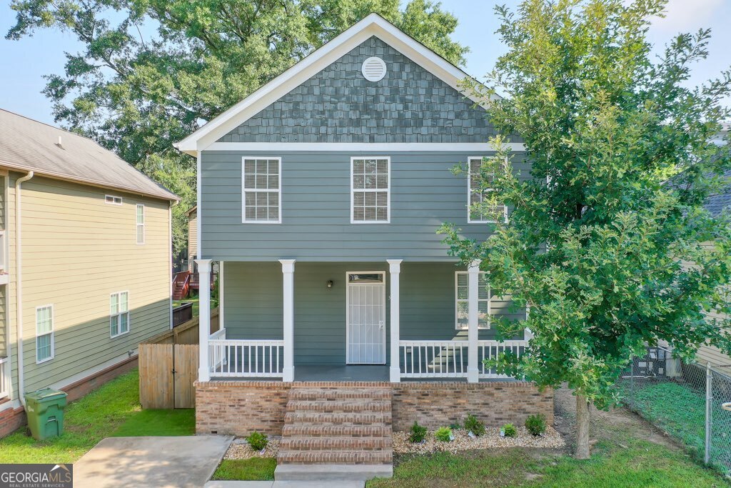 Welcome home to this beautiful, true 5-bedroom home in the heart of the city. This floor plan and offering provides an extraordinary amount of versatility. There is a bedroom, walk-in-closet, and full en-suite bath on the main level. There is an additional powder room on the main level, creating additional value as you host and entertain guests. As you enter through one of two front porches, you'll be impressed by the open floor plan that stretches towards the beautiful kitchen. White cabinets, stainless steel appliances, and granite counters are conveniently located near the back door which opens into a screened-in porch and fully fenced back yard. Enjoy off-street parking in your driveway, freshly painted pewter green exterior, and city views. The upstairs boats 4 bedrooms, one complete with a walk-in closet, supremely convenient access to laundry room, and a beautifully finished, sleek bathroom. This community is extremely popular with both short and long-term rentals. Conveniently located near every major college and university in the Atlanta area, the opportunity for student housing is immense. With proximity to the GWCC, Mercedes-Benz Stadium, and public transportation, this property could be a tremdous asset for AirBnB or other short-term rental options. Last, but certainly not least, owner occupants that desire a move-in ready home with 5/3.5 bed and bath can enjoy the city views, proximity to the BeltLine and easy access to the entirety of the city, MARTA, restaurants and night life, this is the home for you. Enjoy fresh paint inside and out, new water heater, several updated bathrooms, new carpet, and a three-year-old main-level HVAC system. This home has been well-cared for and thoughtfully updated. It is rare to find a true 5 bedroom home in this location and at this price point - come see it today!