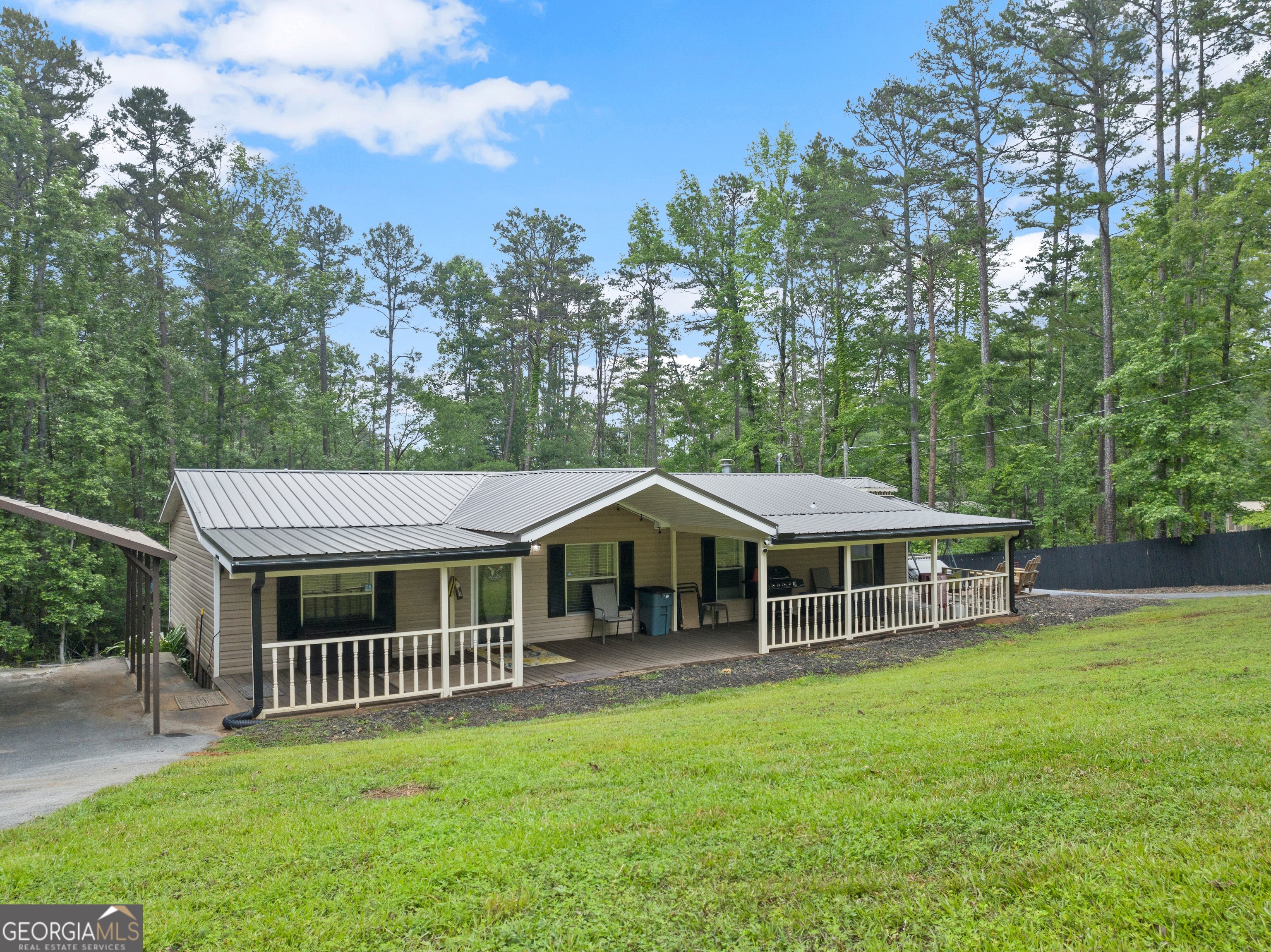 Lakefront Country Living on 8+ Acres! NEW ROOF * NEW HVAC * Updates all throughout! Discover your private retreat with this charming 3-bedroom, 2-bath mobile home set on over 8 beautiful acres of land. Perfectly suited for nature lovers, or those seeking tranquility, this property offers a rare combination of space, functionality, and outdoor enjoyment. The home features a comfortable layout with a spacious living area, a well-appointed kitchen, and a split-bedroom design for added privacy. The master suite includes a private bath, while two additional bedrooms and a second full bath offer room for family or guests. Step outside and enjoy all this land has to offer! A private dock provides direct access to the water-ideal for fishing, kayaking, or relaxing by the shoreline. Several storage sheds are located throughout the property, offering ample space for tools, equipment, or outdoor gear. Whether you're looking for a weekend getaway or a full-time residence with room to roam, this property checks all the boxes.
