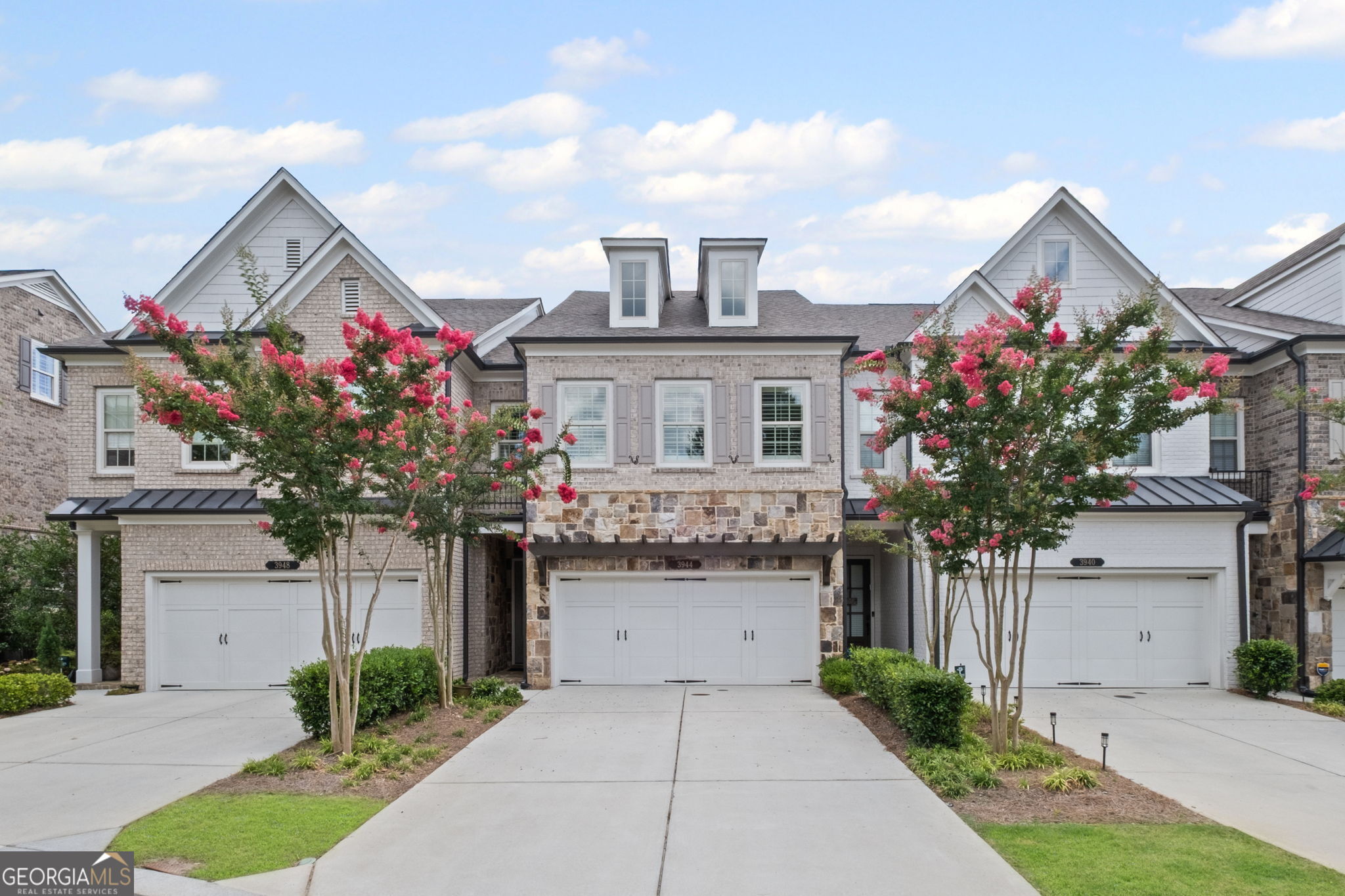 Rare opportunity! Move-in ready, maintenance free luxury Townhome in Walton HS District located in the prestigious Indian Hills subdivision. Upgrades include: plantation shutters & built-in closets. Gourmet kitchen with stainless steel appliances overlooking family room & butler's pantry. Oversized master with dual shower heads & walk-in closet featuring built-in jewelry organizers. Hardwood on 1st & 2nd floors. 3rd level oversized bonus / rec / media / family room. Remote controlled retractable awning over gated patio. Designer wall, epoxy garage floor, digital keypad door lock, ecobee smart thermostat with remote sensors (3) & hot water circulation pump provides instant hot water! Indian Hills Country Club offers award winning golf facilities; 27 challenging holes for the avid golfer, tranquil adult only pool, large kids pool and water park and tennis courts for the tennis enthusiast. The Country Club features Poker Night, Bingo and delicious food served year-round. This immaculate, like new, home shows like a Model home with 3+ spacious bedrooms, 3.5 baths. The garage has direct access to the kitchen, no steps needed! Close to restaurants, shopping and the Avenues East Cobb. Convenient to I 75.