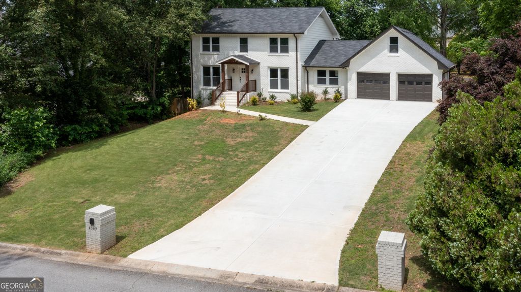 Photo of 4307 Cedar Wood Drive SW, Lilburn, GA 30047 (MLS # 10764932)