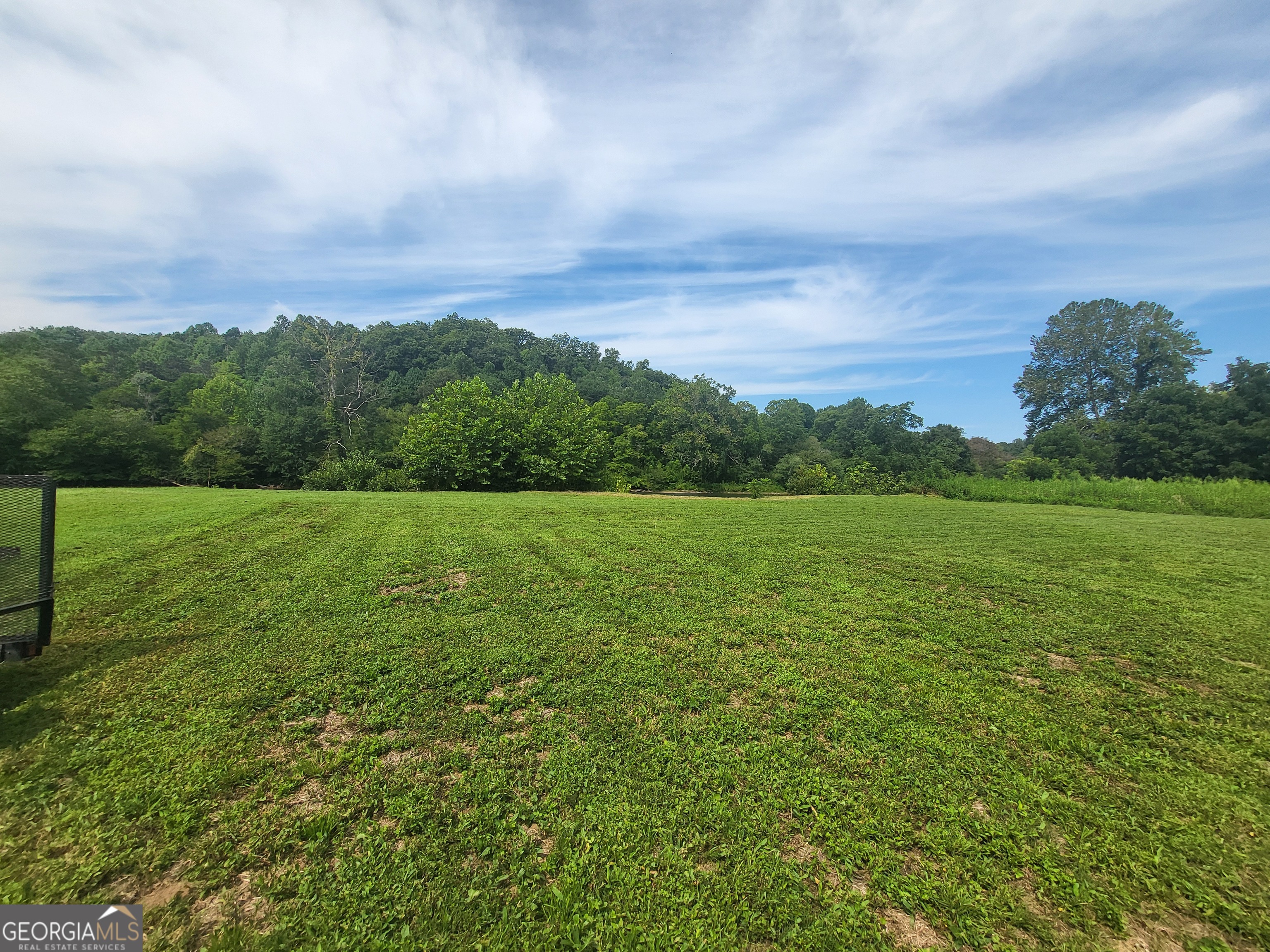 Hard to find UNRESTRICTED river front property like this! The real estate listing agreement expired so we reduced the price by 50k from 249k to 199k! 1.43 acres direct riverfront on the Little Tennessee river. Level, cleared and ready to build on. It has a septic system installed, well already in place and underground power to the property. This is basically unrestricted property. RV's are permitted! There are a few deed conditions, but they are not enforced since there is no H.O.A. It is in a 100 year flood plain so there is a minimum height requirement if you want to build. Between Franklin and Bryson City NC on Hwy. 28 just 9 miles to downtown Franklin. Property goes from Hwy 28 to the river. Land on the other side of river belongs to forestry service so there will not be any homes or buildings built there, just a pristine view as shown in the pictures. The river is clean, clear and flows rapidly with the sound of water rushing over the rocks. Possible payment terms with minimum 20k down. Terms are flexible
