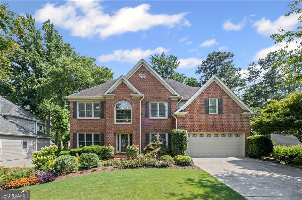 Welcome to 3675 Ridgeway Terrace, a stunning 6-bedroom, 5-bathroom home located in the highly sought-after Bridle Ridge community in South Forsyth. This updated and move-in ready residence offers the perfect blend of luxury, comfort, and functionality, nestled on a picturesque, park-like level lot with lush zoysia grass and low-maintenance perennial gardens. Inside, you'll be welcomed by gleaming hardwood floors and a bright, open layout. The main level features a dedicated study with elegant French doors, as well as a large guest bedroom with a full bath-perfect for visitors or flexible living needs. The expansive kitchen is a chef's dream, complete with granite countertops, a large center island, a walk-in pantry, and an oversized eat-in area that opens up to a light-filled two-story great room. This is the perfect space for time with family and entertaining! Upstairs, every bedroom has direct access to a bathroom. The spacious primary suite serves as a peaceful retreat with a newly renovated spa-like bathroom that includes a luxurious MTI hydrotherapy air bath. Two additional secondary bedrooms share a newly updated Jack-and-Jill bathroom, while a fourth upstairs bedroom enjoys its own recently updated private en-suite bath. The convenient upstairs laundry room features a sink and ample space for organization. The fully finished basement extends your living space with a large bedroom, a full bath, a generous media or playroom, a dedicated workout room, a workshop, and abundant storage complete with built-in shelving. This home has been impeccably maintained and thoughtfully updated. The exterior was freshly painted in 2024, all interior rooms have been recently painted, and windows on the main and second levels have been replaced. The home also features a newer Carrier high efficiency HVAC system and a newer roof with a transferable warranty from Findlay Roofing. Bridle Ridge is known for its top-tier amenities including pickleball and tennis courts, a resort-style swimming pool, a playground, and a beautiful clubhouse. Combined with award-winning schools and a prime location less than three miles from the exciting, soon to open John's Creek Medley, 3675 Ridgeway Terrace is a truly exceptional place to call home.