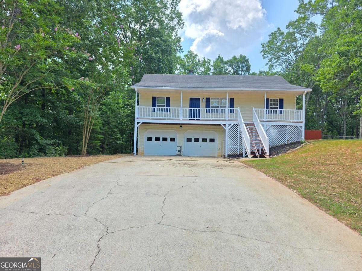 Ready to find your perfect rental? For a limited time - just two weeks! - we're offering $100 off your first month's rent. Charming Raised Ranch in Dallas, GA Welcome home to this lovely 3-bedroom, 2-bath raised ranch in a quiet Dallas, GA neighborhood! Step inside and discover the beautiful laminate flooring that flows throughout, complemented by a cozy fireplace with decorative stone-perfect for relaxing evenings. The home features a large master bedroom offering plenty of space and comfort. Outside, you'll find a spacious driveway leading to a 2-car garage, providing ample parking and storage. The large backyard is ideal for outdoor activities and includes a privacy fence, ensuring your peace and seclusion. This home boasts an excellent location, just a short drive from Rome, GA, where you can enjoy attractions like Berry College, local museums, and scenic trails for outdoor fun. It's also conveniently close to local schools and less than 20 minutes from Villa Rica, GA, offering even more family-friendly activities and amenities. DON'T MISS OUT ON THESE BIG SAVINGS!