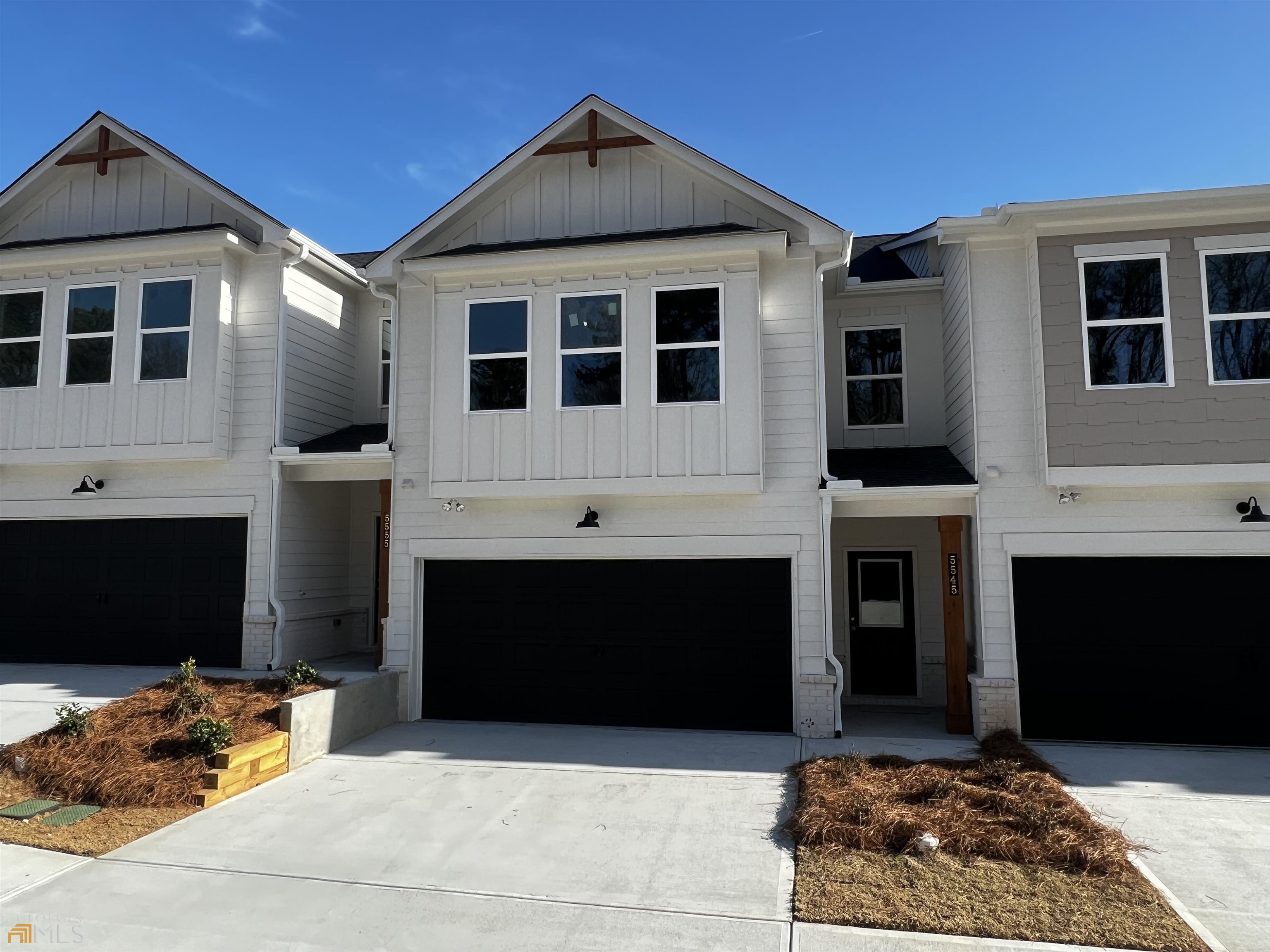 Richardson Housing Group, the Orchard floor plan with covered back porch. Townes at Rockfern community offers a unique collection of rustic urban townhomes that is located just 14 miles northeast of Atlanta, right across the street from Lions Club Park, 3 miles from Tucker, and only 3 miles from the historic, walkable neighborhood called Old Town Lilburn that features restaurants, concerts, city events, and shopping. Our homes are built with a unique blend of soft industrial exterior designs, covered back porches, open floor plan layouts, along with upscale on-trend interior finishes like electric vehicle charging outlets, quartz countertops, LVP flooring, crown molding, stainless steel appliances, white shaker-style cabinets, and owner’s bathrooms that feature oversized fully tiled showers. The homeowner’s association includes lawn maintenance, exterior building maintenance and termite bond. Great Buyer incentives include $7,000 towards closing costs if financing with approved lender. The main photo is of the actual home, the watermarked "Stock Photos" are of the same floor plan previously built, however features, finishes, and colors will vary.