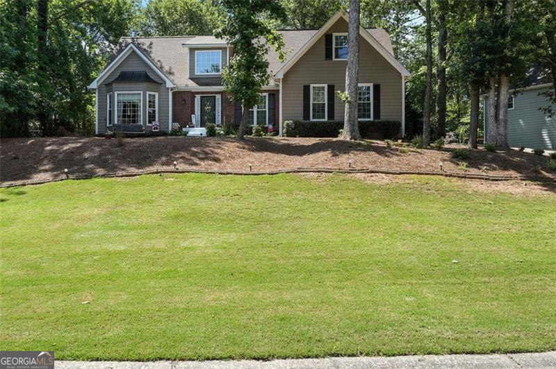Welcome to 912 Spring Valley. This charming 4-bedroom, 2.5-bathroom home features a main-level master suite with a private en suite bathroom complete with a hydro-therapy tub, offering a perfect retreat after a long day. This lovely home is located in the highly desirable Arbors of Towne Lake subdivision-right in the heart of Towne Lake, one of Woodstock's most sought-after golf communities! This established tennis and swim neighborhood offers exceptional amenities and a vibrant lifestyle just minutes from shopping, dining, parks, and top-rated schools. Upstairs, you'll find three additional bedrooms and a full bath, ideal for family, guests, or a home office setup. The upstairs level also comes with a bonus room that is flexible for your needs. The home's layout is ideal for everyday living and entertaining, with a spacious family room and an eat-in kitchen that opens directly to the living area, making hosting a breeze. Step outside to enjoy a large, beautifully landscaped backyard, perfect for relaxing, gardening, or spending time with family and friends. The spacious backyard is fully fenced so the kids can run and play with your pets. Located just minutes from Lake Allatoona and with easy access to I-575, this home combines comfort, convenience, and community in one of Cherokee County's top neighborhoods. Don't miss your opportunity to own in Towne Lake-schedule your private tour today!