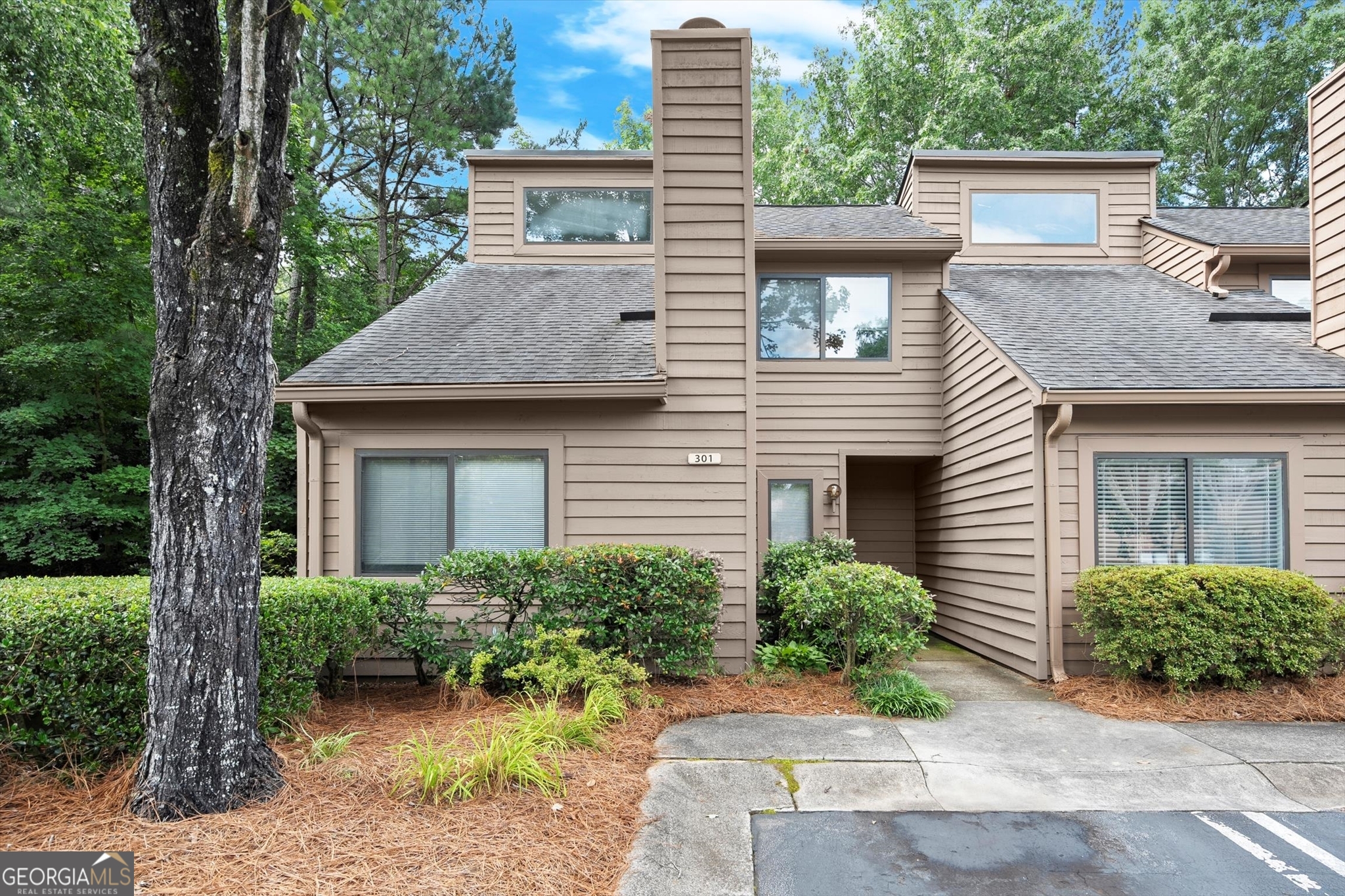 This light-filled 2-bedroom, 2.5-bath end-unit townhome is nestled in a sought-after East Cobb community, zoned for top-rated schools (Sope Creek ES, Dickerson MS, and Walton HS). The open-concept main level features a bright and airy living room with a cozy fireplace-ideal for both relaxing and entertaining. The updated kitchen shines with granite countertops, modern cabinetry, and new appliances. A flexible space on the main floor can be used as a formal dining room, home office, or playroom-whatever fits your lifestyle. Step outside to a private, fenced-in patio bordered by mature trees and peaceful green space-perfect for morning coffee or winding down at sunset. Unbeatable location with quick access to GA-400, I-75, I-285, Roswell Road, and just six miles from the North Springs MARTA station. Enjoy being minutes from The Avenue East Cobb, Merchants Walk, and Paper Mill Village, offering endless options for shopping, dining, and entertainment. Outdoor lovers will appreciate nearby parks, trails, and the Chattahoochee River.