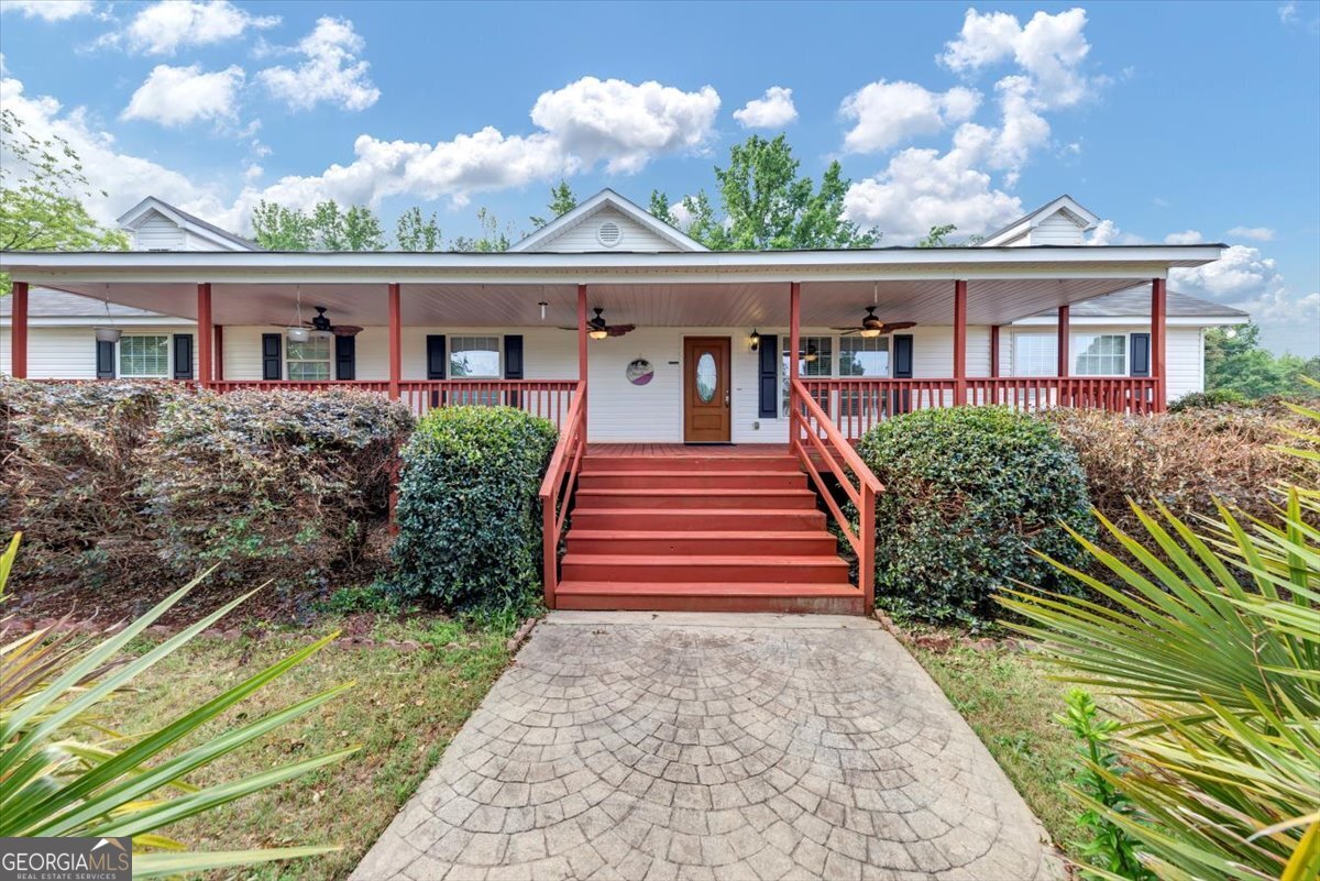 Spacious 5BR/4BA home in Greensboro, GA, minutes from Lake Oconee! Set on a massive lot, this property offers an open-concept kitchen, bright living spaces, and a serene main-level primary suite. The detached outbuilding with a full bath is perfect for guests, a studio, or home office. Enjoy endless outdoor possibilities with ample yard space, all in close proximity to boating, golf, dining, and lake activities. Outbuilding with Full Bath The detached outbuilding is a true bonus featuring its own full bathroom, this flexible space could serve as a private guest suite, hobby workshop, art studio, or even a pool house should you add a swimming pool in the future. Outdoor Living & Lake Proximity The massive lot offers expansive green space for entertaining, gardening, or simply enjoying Georgia's sunshine. Just minutes away, Lake Oconee provides boating, fishing, and lakeside leisure, while nearby golf courses, dining, and marinas enhance the resort-style lifestyle. Remarks Private