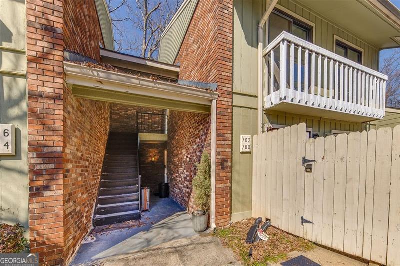 Welcome home to 702 Hanover Lane! This move-in ready 2 bedroom, 2 full bathroom condo has been well maintained & tastefully updated with new luxury vinyl flooring, LED lighting, light & plumbing fixtures & new interior paint. With every room having direct access to a covered patio you can find your favorite place to relax & unwind. This second-story unit has no one above it & comes with access to the attic for additional storage. Located inside of the sought-after Covered Bridge community, you will have access to the community pool, tennis courts & clubhouse. You will also be conveniently located close to shopping, restaurants & Marietta City Schools! **The unit is scheduled to receive a new roof with the special assessment being paid by the seller at closing.**