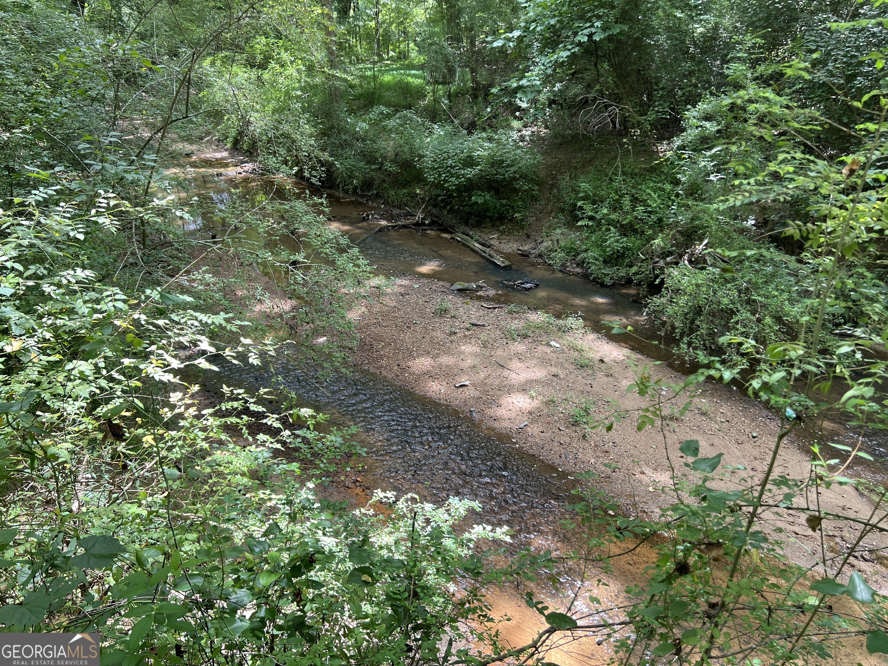 Hard to find 10.14 +/- acre property bordering Ollie Creek in Marietta, Cobb County, Georgia. This property is perfect for your next homesite with mature pine and mature natural hardwood bordering a branch and Ollie Creek. Imagine the trails you can enjoy walking through the park like setting with mature timber and the creek. Excellent place to create your oasis in Marietta, GA. Located only 11 miles from Truist Park. Be close enough to the amenities of Metro Atlanta while maintaining privacy. Zoning: R-20 (Cobb County). Utilities: Water, Sewer (check elevation), & Power. Topography: Level to Gently Rolling. Bufordi Drive ends at the property. Property is on the right side where Bufordi Drive ends (not a cul de sac). Coordinates: 33.886954, -84.606364 0.5 Mile to Hollyday Elementary School 1 Mile to Smitha Middle School 4.8 Miles to Osborne High School 6.9 Miles to Downtown Marietta 7.9 Miles to Smyrna Community Center 11 miles to Truist Park 11.3 Miles to McCollum Field (Cobb County International Airport) 20.4 Miles to Downtown Atlanta 25.4 Miles to Hartsfield Jackson Airport