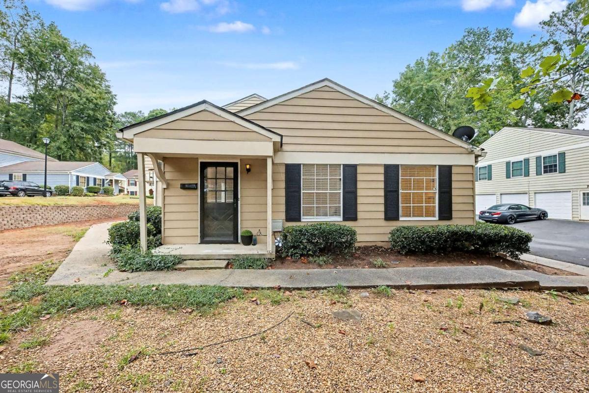 Welcome to this beautifully updated ground-floor condominium in the desirable Bellemeade Commons community of Marietta. This bright and open 2-bedroom, 1-bath home features a spacious, inviting floor plan filled with natural light and stylish updates throughout. The interior showcases beautiful light-toned, wood-look flooring throughout that adds warmth and a modern touch to every room. The kitchen offers white cabinetry, ample storage, and convenient garage access, along with a view to the family room for easy entertaining. Enjoy the convenience of a parking pad for two cars near the front door and a private one-car garage, providing plenty of space for everyday living. Recent updates include fresh interior paint, updated lighting, blinds, and modern fixtures throughout. This home is all on one level, completely private, with no shared walls and no one above, making it perfect for a first-time homebuyer or someone looking to downsize. Located just minutes from Marietta Square, Downtown Smyrna, and The Battery Atlanta, this move-in-ready home offers modern comfort, convenience, and timeless appeal!