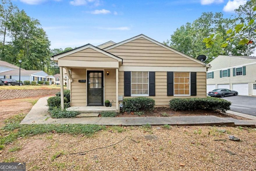 Welcome to this beautifully updated ground-floor condominium in the desirable Bellemeade Commons community of Marietta. This bright and open 2-bedroom, 1-bath home features a spacious, inviting floor plan filled with natural light and stylish updates throughout. The interior showcases beautiful light-toned, wood-look flooring throughout that adds warmth and a modern touch to every room. The kitchen offers white cabinetry, ample storage, and convenient garage access, along with a view to the family room for easy entertaining. Enjoy the convenience of a parking pad for two cars near the front door and a private one-car garage, providing plenty of space for everyday living. Recent updates include fresh interior paint, updated lighting, blinds, and modern fixtures throughout. This home is all on one level, completely private, with no shared walls and no one above, making it perfect for a first-time homebuyer or someone looking to downsize. Located just minutes from Marietta Square, Downtown Smyrna, and The Battery Atlanta, this move-in-ready home offers modern comfort, convenience, and timeless appeal!