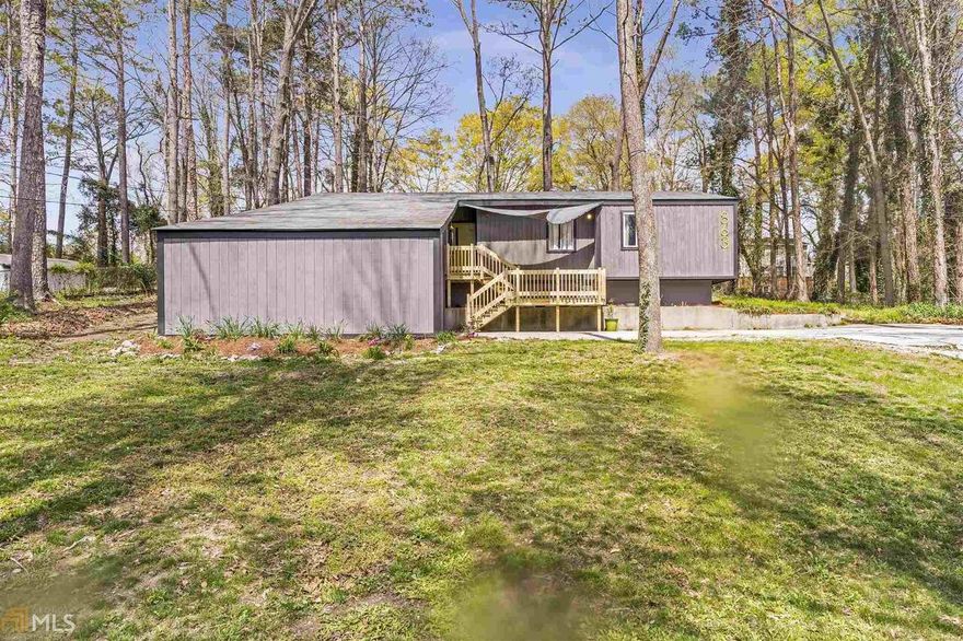 Perfectly renovated 3 bed, 2 bath ranch in Conyers Winchester Hills!  70’s style sunken living room open to the kitchen and dining area which is perfect for entertaining!  Beautiful solid surface countertops with soft close drawers and cabinets, stainless steel appliances and a breakfast bar!  Owner’s suite features sliding barn door closet, double sinks, and a shower with body jets! 2 secondary bedrooms and a full bath with a stunning brass showerhead and brass fixtures. Semi-covered back patio with a fire pit feature. You can see the love and care that was poured into this home!  This one will NOT last!!