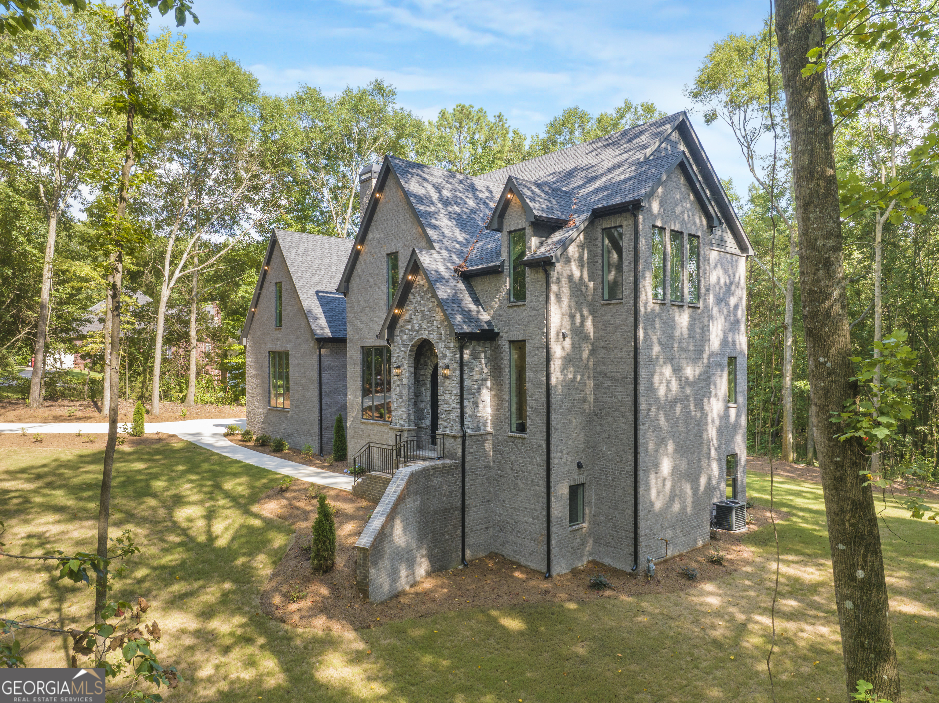 New Construction on 8.55 Acres with Private Lake Access- Commerce, GA This brand-new home sits on 8.55 private, wooded acres in Commerce, offering the perfect blend of peaceful living and modern design. Plus, access to your own lake right in the backyard. The main level features a bright, open kitchen with a large island, custom hood, and beautiful views of the trees. Tucked away is a spacious scullery with extra cabinets, a second sink, dishwasher, and beverage fridge, ideal for keeping prep and clean-up out of sight when hosting. The primary suite feels like a retreat, with a double vanity, separate dressing area, and a gorgeous stone shower that includes a freestanding tub. The walk-in closet connects directly to the laundry room for everyday ease. There's also a cozy office with a fireplace and a welcoming foyer with a coat closet and a pamper room, a great bonus space for storage or daily routines. Upstairs, you'll find three bedrooms. One with a private bath and walk-in closet, and two connected by a Jack and Jill bathroom, designed to offer both privacy and functionality for family or guests. The fully finished, walk-out basement expands the living space with a complete second kitchen, island, and built-in wine storage. A glass wine closet is the focal point as you enter, combining design and utility in a striking way. A three-level staircase connects all floors, making the layout feel seamless and accessible. Outside, you'll love the quiet privacy of the woods and the access to the private lake, great for light fishing, paddling, or just enjoying the view. The water stays fresh thanks to a natural stream that keeps it moving, and watercraft access is included. Bass and crappie have been caught here, making it a fun spot for casual fishing right in your own backyard. Opportunities like this don't come often. Schedule your showing today!