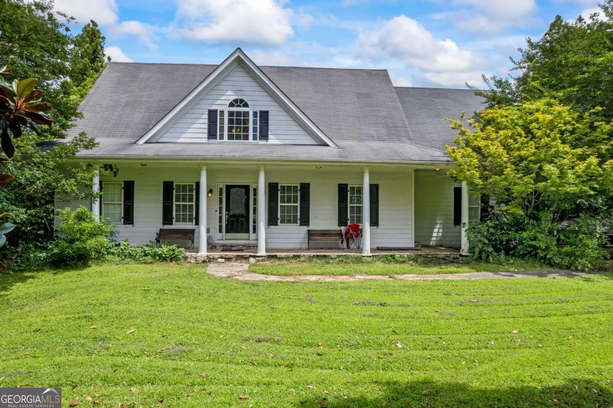 **Cash Only** Incredible Investment Opportunity in Hoschton! This spacious 4-bedroom, 3 full bath, 2 half bath home sits on a level 1.5-acre corner lot and offers exceptional value with endless potential. The main home features a fully finished in-law suite in the basement - ideal for multi-generational living or added rental income. Outside, a massive 6-car detached garage includes a 1-bedroom, 1-bath apartment above, perfect for additional rental potential or guest accommodations. Being sold AS-IS with no disclosures, this property is an excellent opportunity for investors, landlords, or buyers ready to bring their vision to life. Don?t miss this chance to own a versatile home with income-producing possibilities in a prime Hoschton location.