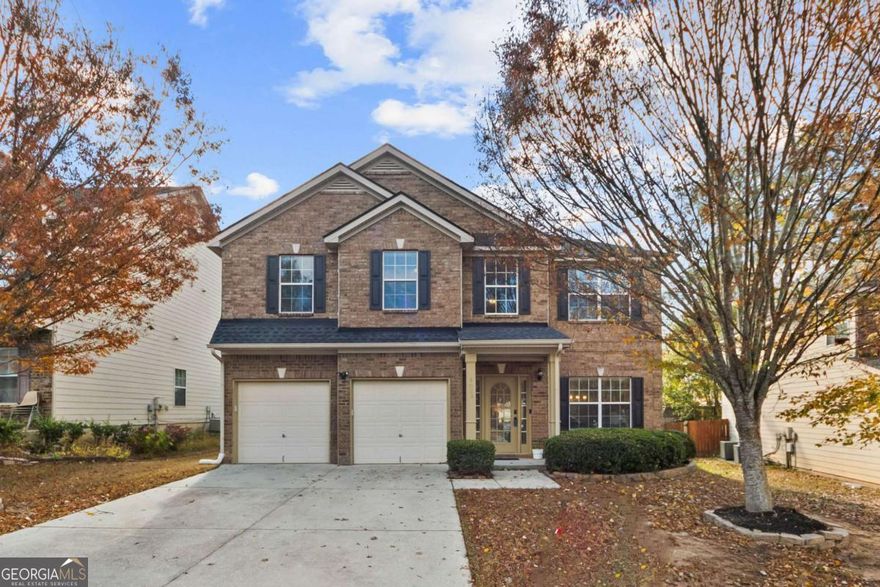 Welcome home to this captivating single-family gem in the highly sought-after Cooper Manor Subdivision, zoned for Gwinnett County Schools. Built in 2008 and immaculately kept by a single owner, this home still looks new and already has upgrades. As you enter an impressive 2-story foyer, notice the high ceilings and gorgeous updated hardwood floors throughout the main level. The original interior paint is neutral and nearly flawless throughout, giving you an easy canvas for your own personal touches. To your right, you find an elegantly decorated dining room accented by an abundance of natural light. Proceed forward and be amazed by a spacious open concept with a well-appointed firelit family room, eat-in kitchen, and breakfast area. The kitchen comes with stainless steel appliances and plenty of stylish stained cabinetry for ample storage.  Your beautiful wooden floors continue upstairs and throughout the upper level. Behold -- a massive loft area, excellent for gaming, a Peloton gym, library, secondary family room, or whatever you like. To your right, you find 2 nice-sized guestrooms which share a full bath, and to your left, an incredible oversized primary suite sure to induce restful nights. Your en-suite bath features modern double vanities, separate tub and shower, and low-maintenance hard-surface flooring - the perfect combination of style and comfort.    The Cooper Manor Community allows for convenient access to an abundance of nearby shopping centers, restaurants, entertainment venues, all within 5-20 minutes away! Enjoy easy access to GA Hwy 78, and you are only 45 minutes to Hartsfield-Jackson Airport. Home is priced to sell fast. Seller is open to contributing toward buyer's closing costs or interest rate buydown if the purchase offer is for full list price or higher.