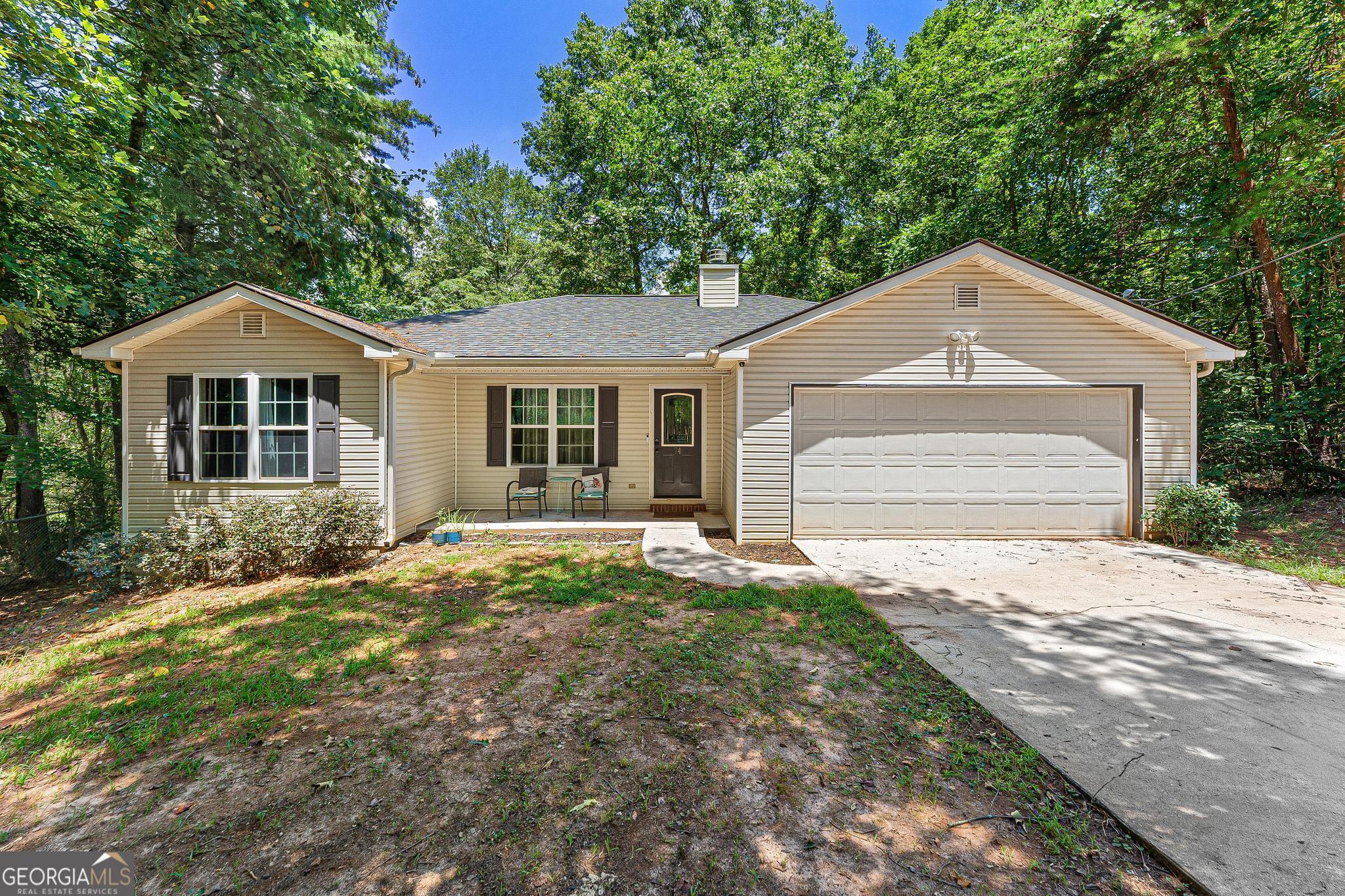 Here is a place for you to call home. Featuring 3 bedrooms, 2 baths, a spacious, open kitchen with plenty of cabinets, and a fenced in back yard. Both bathrooms have double vanities, and the main bedroom has his and hers closets. The living room has a vaulted ceiling and also features a nice fireplace. This home is convenient to I-85 access and is just a golf cart ride away from Harbor Light Marina! Give us a call or text at 706-436-0706 for more information.