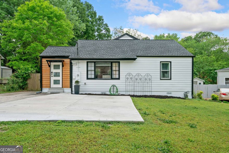 Charming ranch-style home with no HOA just minutes from Historic Marietta Square! This move-in ready home has been meticulously cared for, featuring a new 2023 roof and updated electrical and plumbing systems, all completed to current code with inspection documentation available for peace of mind. The exterior boasts fresh paint and a newly updated deck, enhancing its curb appeal. The spacious, flat, fenced backyard is perfect for outdoor living, pets, or entertaining - ideal for grilling or simply relaxing outdoors.  Inside, a welcoming bonus room offers flexible space for a home office, playroom, or second living area. The kitchen seamlessly flows into the family room, creating an open, connected layout that's perfect for entertaining.  The home offers two spacious bedrooms, including a generous primary suite with a walk-in closet and private en suite bathroom.  Conveniently located near major highways, shopping, dining, and everything Marietta has to offer! This home is a must-see!