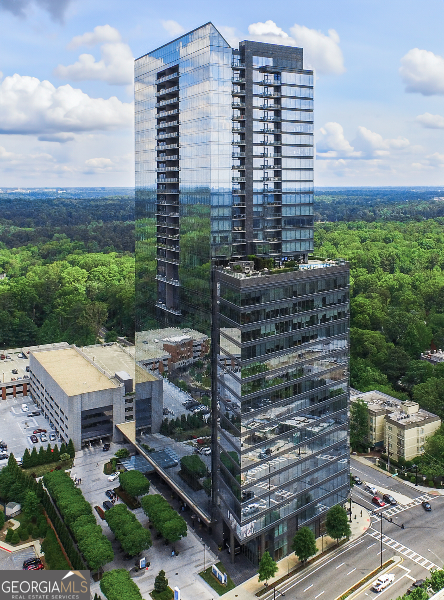 Sophisticated Buckhead Penthouse with Unrivaled Privacy, Views, and Entertaining Spaces. Experience a haven of opulence where the legendary Ritz-Carlton service defines your daily life. This extraordinary residence showcases the masterful interior design of Robert Brown, one of Atlanta's most celebrated designers whose sophisticated aesthetic and timeless vision have earned him Veranda magazine's Southeastern Designer of the Year and over twenty American Society of Interior Designers (ASID) awards. From attentive concierge assistance to in-residence dining and a dedicated residential management team, every detail is curated to ensure unparalleled privacy, comfort, and convenience.  Step into a world of timeless luxury perched on the prestigious 34th floor. This exclusive penthouse-one of only two residences on this top level-offers a sanctuary above the city. With 3 bedrooms, an office, and 3.5 bathrooms, this elevated retreat redefines elegance and sophistication. Expansive, unobstructed 270-degree panoramic views capture Atlanta's diverse beauty, including sweeping vistas of the Perimeter Area, Brookhaven, Buckhead, Midtown and Downtown Skylines, Stone Mountain, and iconic landmarks like Kennesaw Mountain. Each sunset casts a masterpiece of color across your windows, drawing you into a moment of awe and reflection at the breathtaking spectacle.  The primary suite is a serene sanctuary, complete with a private seating area and elegant fireplace. Enveloped in tranquility, the spa-like ensuite bathroom boasts heated marble floors and luxurious finishes. Dual vanity areas and two expansive walk-in closets create an indulgent, personal retreat that whispers comfort and sophistication. Each additional bedroom is designed as a private oasis, offering en-suite bathrooms with exquisite marble finishes. Every corner of this home radiates with warmth and refined detail, providing unparalleled comfort for family and guests. A private office with rich wood-paneled walls offers an inspiring workspace framed by stunning skyline views.  Feel the luxury of seamlessly connecting to your home through a premier Savant home automation, allowing effortless control of blinds, drapes, lighting, thermostats, and entertainment systems. At the touch of a button, transform the atmosphere to match your mood, whether it's a cozy evening in or a vibrant gathering of friends.  Designed with entertaining in mind, the residence boasts an expansive gathering space. A stylish bar with a large wine fridge complements the floor-to-ceiling windows, which frame spectacular views. Two private balconies provide the perfect escape to enjoy a morning coffee or unwind with a glass of wine beneath the stars. The open-concept living area harmoniously blends a welcoming living room with a fireplace and a chef's kitchen outfitted with top-tier Viking appliances. Every detail elevates your hosting experience-a celebration of taste, style, and connection.  Further amenities include: o A resort-style pool, updated fitness center, massage room, and outdoor grilling and gathering areas for unparalleled relaxation. o Two private guest suites for visitors, ensuring their stay is as luxurious as yours. o Four secure parking spaces with valet service and two private, climate-controlled storage rooms for added convenience.  Situated in the heart of Buckhead, this penthouse offers unmatched proximity to fine dining, luxury retail, and Atlanta's most coveted attractions. More than just a residence, this home is a testament to the art of living well. From the award-winning design sensibilities of Robert Brown to the legendary Ritz-Carlton service, every moment in this extraordinary space feels like a masterpiece of urban luxury.  Discover the life you deserve. Let this penthouse redefine what home means to you-where breathtaking beauty, unrivaled privacy, and world-class service converge into an experience that transcends the ordinary.