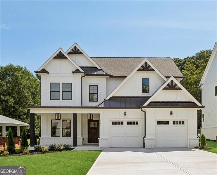 New Construction next to popular Williams Park! So convenient to the Smyrna Market Village and the Battery! This impressive modern farmhouse/craftsman-style home features a gorgeous stained wood front door, a 4-sides brick water table with a board-and-batten front, covered front and rear porches, and a HUGE professionally landscaped yard. The interior offers a dining room with a beamed ceiling, site-finished hardwood floors, an open kitchen with high-end quartz countertops, stainless steel appliances, an enormous island opening to the large family room, and a bedroom/study on the first floor. Upstairs, you'll find a lovely master bedroom and bath, two additional spacious bedrooms, a sizable hall bath, and an enormous loft/media/playroom + bonus room. This impressive home's included upgrades and finishes are just "icing on the cake". This one is a winner for sure!