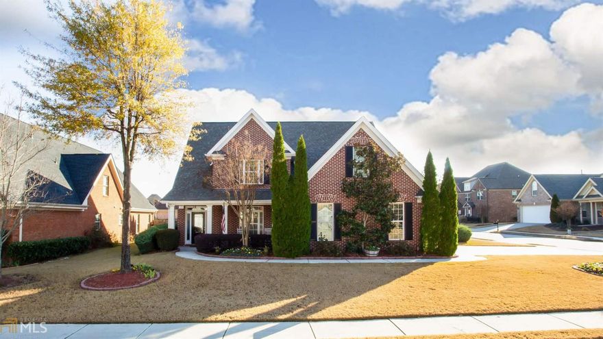 WOW! Former model home in lovely Madison Park s/d in Grayson! This home has all the bells and whistles...3 bdrms/2.5baths, all brick home, corner lot w/ side entry garage, huge eat-in kitchen w/ granite & island, dbl oven, sep. cooktop, SS appls., including refrigerator, hdwd floors, new carpet in bdrms, master on main, tons of cabinets, storage, his/her closet system in master, screened porch, sep. DR & laundry room, 2 large bedrooms up, w/ oversized J&J bath, including bonus room, & add'l space for office or playroom, close to schools & City of Grayson!  This house has so many upgrades, lots of beautiful trim, custom book cases flank the gas log fireplace, sprinkler system, security system, NO YARD WORK...HOA covers yard maintenance, one owner meticulously maintained, with roof less than 5 years old! Bring your Buyers to this lovely home, they will love it!