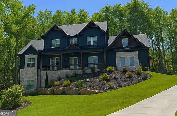 Perched on 1.78 private acres, this 2023 custom-built home brings together thoughtful design and modern luxury in an entertainer's dream setting. The heart of this estate is its outdoor space that boasts a 22,000 gallon heated gunite pool with spa and baja shelf. Covered porches with rocking chairs and overhead fans provide a retreat from the sun, while multiple TVs, soundbars, seating areas and fireplaces create a full entertainment experience. A creek runs along the side of the property, adding a natural soundtrack when it rains, and it's not uncommon to see deer pass through the front yard early in the mornings. From the west-facing front porch, enjoy colorful sunsets that turn each evening into a show of its own. With 4,018 finished square feet above grade and a 2,247 square foot walk-out basement (equipped with high ceilings and bath plumbing ready for completion), this property offers both sophistication and potential. The main floor features a chef's kitchen with black ZLINE appliances, stunning quartz countertops, and a walk-in pantry, opening to a two-story living room filled with natural light. A wood stove anchors the room, offering warmth and charm. Also on the main level: the primary suite with dual closets and a spa-like bath with soaking tub, plus a private office, walk-in laundry, and a guest bedroom with full bath. Upstairs, you'll find three additional ensuite bedrooms, an oversized theatre/bonus room with its own bath, and even a second laundry for convenience. While peaceful and private, this property is just minutes from Publix, local schools, and Lake Allatoona. And just 0.3 miles down the road, Qualusi Vineyards offers tasty wine, beer taps, live music, food trucks, and weekend markets - a perfect neighborhood amenity! 161 Blossom Trail is more than a home-it's a retreat.