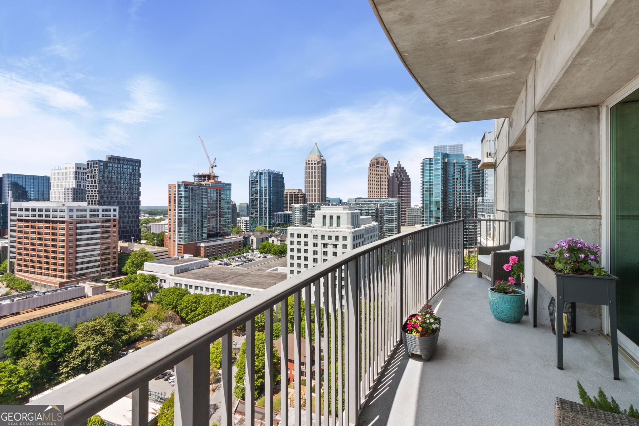 HIGH UP OVER PEACHTREE STREET THIS END UNIT WITH PROTECTED MIDTOWN VIEWS OFFERS AN OVERSIZED BALCONY, DEEDED STORAGE UNIT & TWO COMPLETELY COVERED SIDE BY SIDE PARKING SPACES CLOSE TO THE ELEVATORS. Separate DR area as you enter but open to the kitchen and LR areas. The kitchen boasts all new SS appliances including an oven with a built-in air fryer. A "custom built" extended walk-in pantry will allow for tons of additional storage plus hosts a full size stack W/D & separate freezer. Enjoy LV flooring & electric blinds in the LR. Both of bedrooms feature floor to ceiling glass windows (not always available in other floor-plans) & black out shades & double closets. The guest room also features a Murphy Bed for guests and also serves as a great home office. Each of the two full baths offer granite & tile. Relax in comfort with a BRAND NEW HVAC SYSTEM ! *********$10,000.00 BUY DOWN PAID BY SELLERS*********** If closed by 9/30/25 FHA & VA APPROVED. Metropolis has an excellent management company and board who keep the building in excellent condition & financially sound.