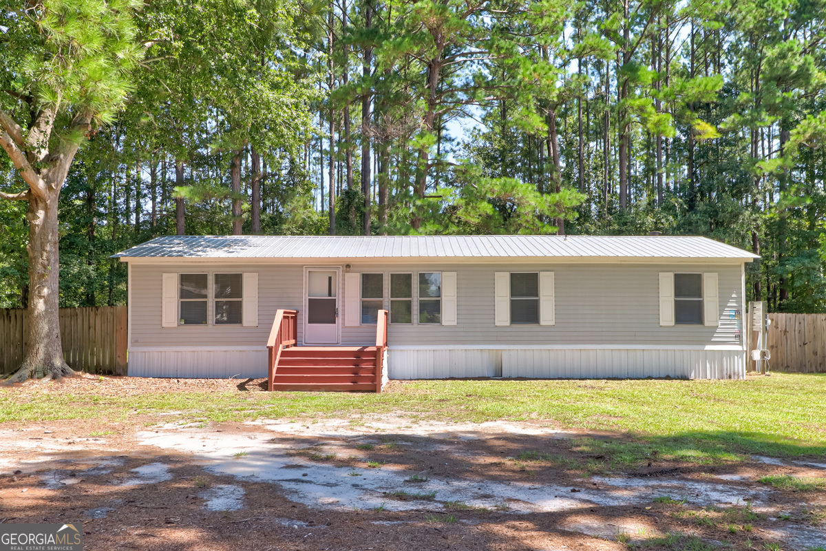 3 Bedroom, 2 Bath Home on Spacious .78 Acre Lot. This charming 3 bedroom, 2 bathroom home offers comfort, updates, and plenty of outdoor space. Featuring a durable metal roof, cozy fireplace, and stylish bamboo flooring, this home is move-in ready with thoughtful upgrades throughout. The kitchen comes fully equipped with all appliances, including a brand-new stove, while new blinds throughout the home add a fresh touch. The primary suite includes a spacious bath with a separate tub and shower for relaxation. Step outside to enjoy a privacy-fenced backyard with a wood fence, perfect for pets or gatherings. A rear patio extends your living space outdoors, and a shed in the backyard provides extra storage. With plenty of space, updates, and a peaceful setting, this property is a perfect place to call home!