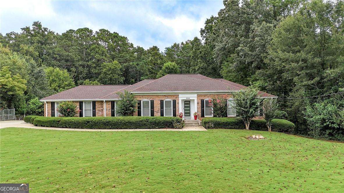 Welcome to this beautifully appointed 5-bedroom, 4.5-bathroom ranch-style home located in the prestigious Terrell Mill Estates subdivision in East Cobb. Sitting on over 1 acre of lush, private land, this expansive 4,900+ sq. ft. residence delivers timeless luxury, modern updates, and exceptional indoor-outdoor living. From the moment you arrive, you'll be captivated by the home's curb appeal and elegant charm. Inside, you'll discover a gourmet chef's kitchen featuring high-end appliances, custom cabinetry, and a spacious island-perfect for entertaining or preparing everyday meals. The open-concept layout flows into bright and inviting living and dining spaces designed for both comfort and style. The secondary bathrooms have been updated. Delight in a spa-inspired primary suite, with a jetted tub and thoughtful design, elevating your daily routine. The fully finished basement provides versatile space for a home theater, gym, office, or in-law suite, tailored to fit your lifestyle needs. Step outside to your backyard retreat featuring a saltwater inground gunite pool, a stylish pergola, and plenty of green space to relax, entertain, or play. Located just minutes from I-75, I-285, and The Battery Atlanta, you'll enjoy unbeatable access to world-class dining, shopping, and entertainment while still enjoying the peace and privacy of one of East Cobb's most established neighborhoods. This move-in-ready home in Terrell Mill Estates is a rare opportunity to enjoy the best of East Cobb living-schedule your private tour today!