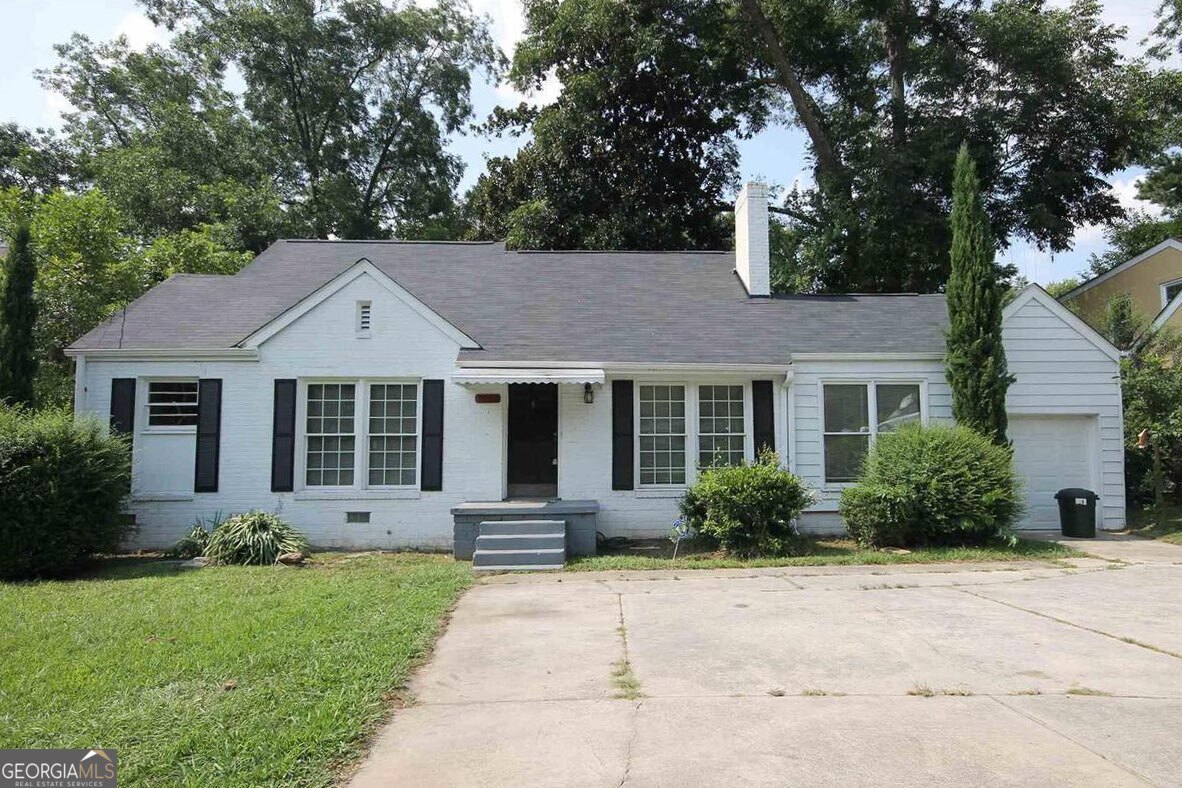 Opportunity knocks. Make a few repairs and move in with equity or have a nice rental. Larger than it looks with 4 bedrooms and 2 baths. Hardwoods. Brick. Dishwasher & large laundry room. Ample storage and one car garage! Private, flat, fenced back yard. Open up the floorplan and trick it out. And you can't beat the location. Less than 1/2 mile from Walmart and many other shops/restaurants. Emory University and the CDC are right up the road. Fantastic AAA rated public schools. Don't wait on this one. Tax assessor has it valued at $422k. Very similar home a few doors down recently sold for $685k. This deal won't last