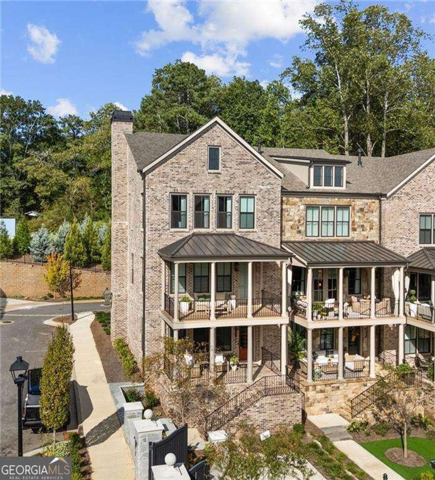 There are homes that check boxes... and then there are homes that check every lifestyle desire. This one is the latter. From the moment you walk up, the double front porches set the stage for a life of effortless elegance. Picture yourself starting the day with coffee in hand, overlooking the courtyard as the neighborhood wakes up. In the evening, a glass of wine upstairs on the primary porch as the city lights twinkle in the distance. Inside, sunlight dances across wide blonde hardwoods, elevating a palette of quartz, champagne fixtures, and custom lighting that feels more boutique hotel than suburban townhome. The open-concept kitchen, dining, and living space flow together seamlessly, making entertaining as natural as breathing. Upstairs, the primary suite is a sanctuary with a closet so generous it whispers promises of never fighting for hanger space again. Guests are equally cared for with spacious secondary bedrooms, while the finished terrace suite flexes into the perfect office, gym, or weekend retreat. This isn't just square footage. This is freedom with finesse, an end-unit with unmatched width, thoughtful separation, and a future-proofed elevator shaft that makes "forever home" more than a possibility.        And then there's the location. Nestled between Avalon and Downtown Alpharetta, you'll never choose between a five-star dinner or a boutique shopping spree, you'll simply decide which direction to walk.        For the empty nester or single with sophistication, the executive seeking low-maintenance luxury, or the buyer who refuses to compromise on style, this townhome is more than a place to live. It's a statement.