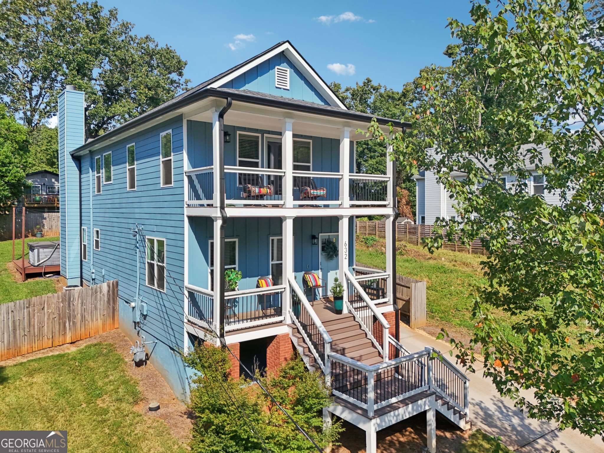 This beautifully updated home blends modern style with everyday comfort, minutes from Decatur, Avondale Estates, and Emory. Not only is this home move-in ready, but buy with confidence knowing this home has already appraised for well beyond the list price, offering instant equity. Sun-filled, open-concept spaces feature herringbone wood-look tile floors, a welcoming dining room and a chef's kitchen with durable quartz countertops, subway tile backsplash, and stainless steel appliances. The spacious living room offers a cozy fireplace and easy access to the fenced backyard and driveway-perfect for indoor/outdoor entertaining. Upstairs, hardwood floors lead to a stunning primary suite with vaulted ceilings, private balcony, and spa-inspired bath with dual vanities, soaking tub, and glass shower. Two additional bedrooms and a full bath provide flexibility for family, guests, or a home office. Out back, enjoy a large deck, storage shed, hot tub and plenty of green space for play or gardening. The neighborhood park and pool adds even more ways to relax and connect with neighbors. Major updates include roof & HVAC (2018) plus siding, energy efficient windows, doors, gutters, porch railing, and steps (2022) giving you the ultimate peace of mind. Easy access to Emory Hospitals, CHOA, Dekalb Farmers Market, Decatur Square, Oakhurst, Avondale Estates, and quick access to I-285 and the airport, make this home the perfect intown home base. Schedule your showing today and make this Scottdale gem yours!