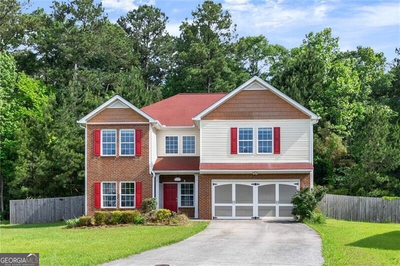 Welcome to this beautiful 4 bedroom, 3 full bath home nestled in a peaceful neighborhood in Powder Springs. Designed for both comfort and style, this spacious home has newer LVP floors throughout and interior has just been freshly painted. The bright and welcoming 2-story foyer opens into a dramatic 2-story family room complete with a cozy fireplace-perfect for relaxing or entertaining guests. Spacious kitchen features plenty of cabinet space, a sunny breakfast area and stainless appliances. A rare bedroom on the main level with an adjacent full bath offers ideal space for guests, in-laws or a home office. Upstairs, you'll find an oversized primary suite boasting elegant trey ceilings, a second fireplace for those cozy nights, and well appointed ensuite bath, creating your own private retreat. Two additional secondary bedrooms conveniently share another full bath. On over half an acre, the fenced backyard provides privacy and tranquility with views of the surrounding trees-ideal for outdoor gatherings or simply unwinding after a long day. Don't miss your chance to own this exceptional home in one of Powder Springs' most desirable non-HOA communities!