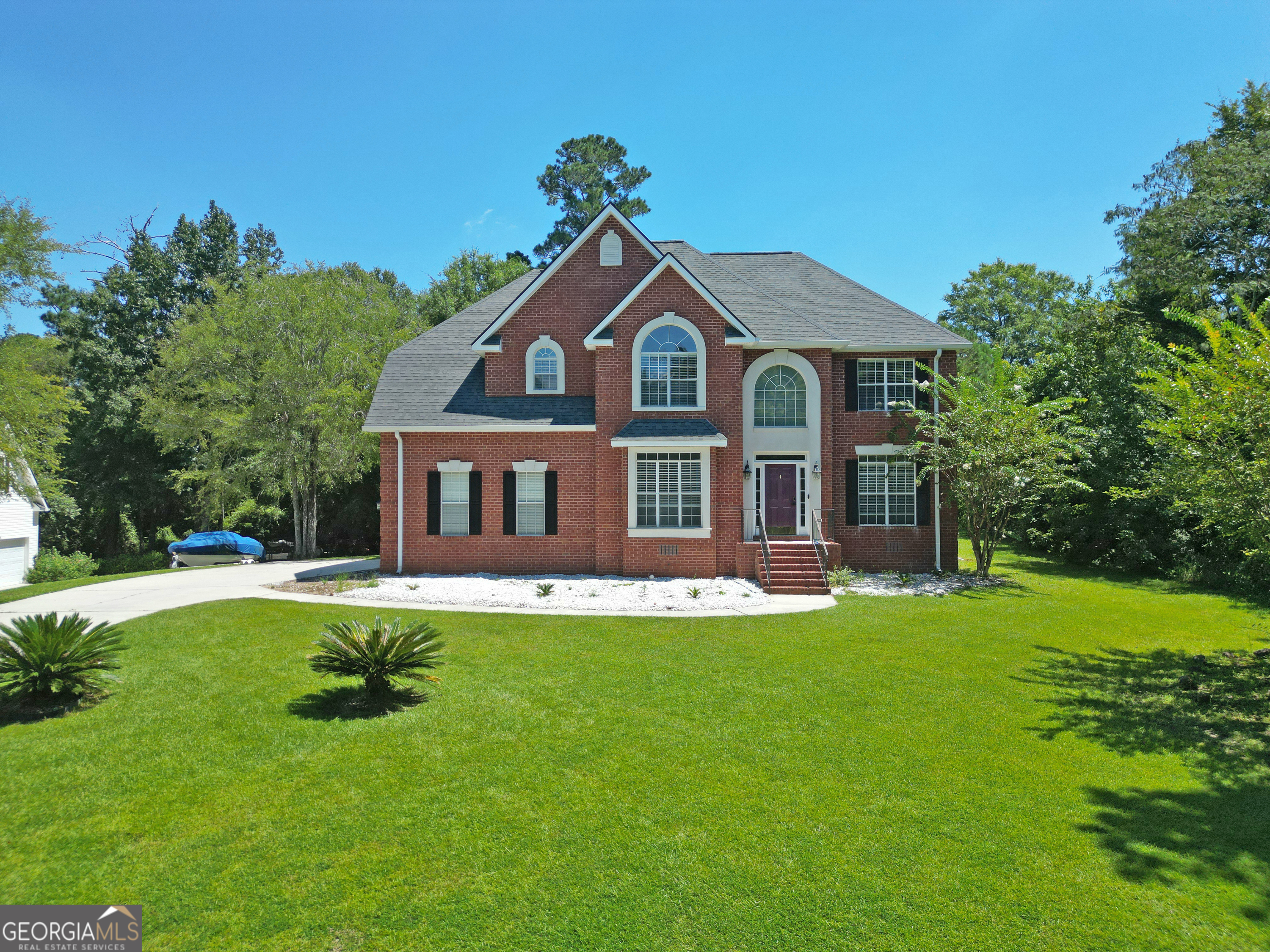 Welcome to Lake Tobosofkee's Water's Edge community. This Beautiful Brick beauty was custom built and has been lovingly updated and maintained. Not only 4 spacious bedrooms but two living areas, a formal dining room and cozy breakfast nook. The primary bath is a lavish size with dual sinks, a large jetted tub and separate shower. New paint, carpet, updated dishwasher and HVAC units, and also a garage refrigerator perfect for holding those quick grab and go beverages. Great price for such a spacious home within a popular lake community. This home is within walking distance to community boat ramp and beach. Seller to provide a one year American Home Shield Essential Policy to buyer at no cost.