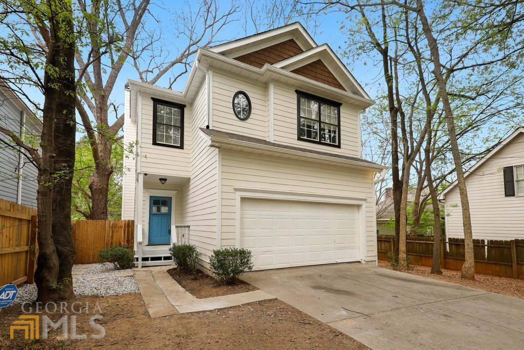 Beautifully Renovated 3 Bedroom, 2.5 Bath 2 story home. Complete with granite countertops, stainless appliances, New range, a wood burning fireplace with a gas starter. Refinished Hardwood floors throughout the main level and Brand New Carpeting in the upstairs, Fully Renovated Bathrooms with laundry on the second level. Freshly Painted Exterior and Interior, 2 car garage, central heat & air and energy efficient windows. The fully fenced in backyard with a large deck is perfect for entertaining. Conveniently located to highways, Midtown, Downtown and Grant park adjacent.