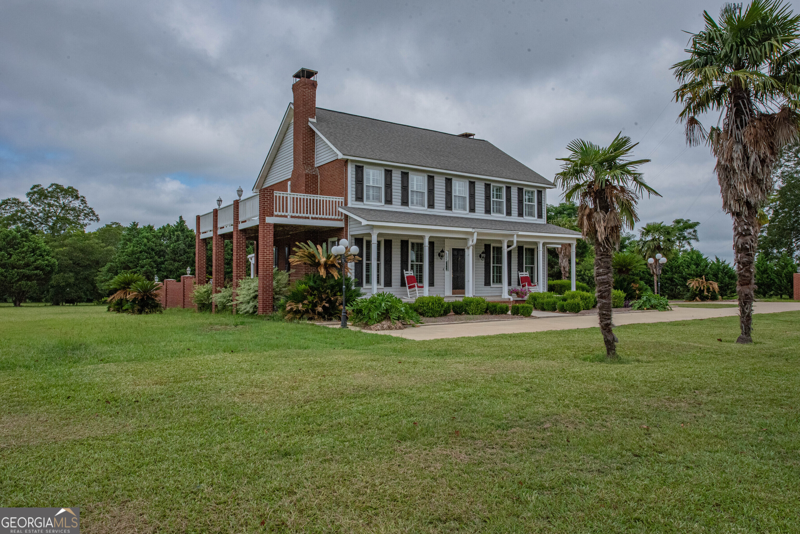 Come home to this lovely, one of a kind property in Vienna GA. approximately 5 minutes from I-75. Far enough from the city, yet close enough! Short drive to Lake Blackshear approximately 16 miles for boating, fishing & marina. Rocking chair front porch greets you in this 3 bedroom, 2 and a half bath 2,911 sq ft home. There is an extra large game or sunroom, that is heated and cooled on the main level but with its own split unit. There are 2 fireplaces, heart pine floors throughout the main level and tile with pine inlay in the foyer and kitchen. Main level boasts a living room (w/built in shelving), formal dining room, keeping room, office and kitchen with an island(and a Jenn-Air stove), large laundry room with a huge pantry space, a half bath and the sunroom. Upstairs is the primary bedroom with a lovely ensuite (with jet tub)and opens to a large deck that overlooks the nearly 3 acres of beautiful, landscaped grounds. The other 2 generous sized bedrooms are upstairs, as well as a full guest bath. The home has a soft water system, a tankless hot water system, new HVAC in 2023 and new windows in 2024. Landscaping is meticulously maintained and is lovely with specialty lighting all around the home. Last but not least is the huge workshop that's just under 1,000 square feet. You won't regret coming out to view all this home has to offer.