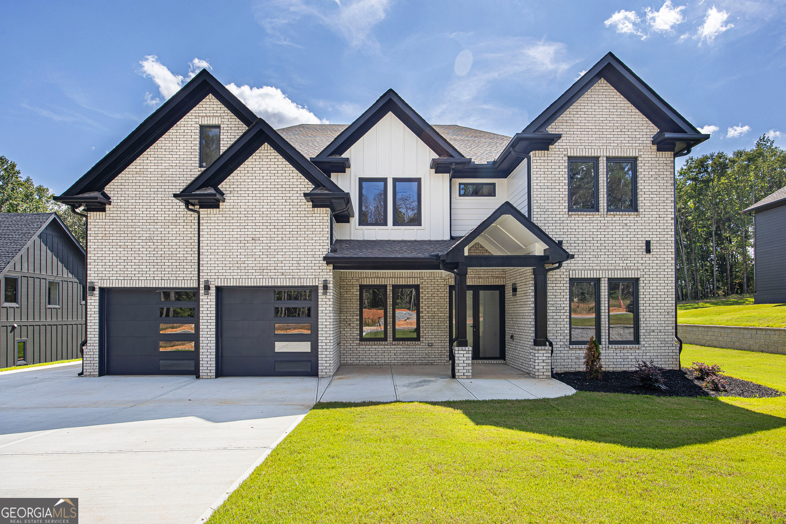 Welcome to Luxury Living in Auburn, Georgia! This brand-new 5 bedroom, 4.5 bath home offers elegance, comfort, and convenience in one of Auburn's most beautiful and fast-growing communities. Step inside to an open-concept floor plan that flows seamlessly from the chef-inspired kitchen into the spacious living and dining areas-perfect for entertaining or everyday living. The main level features a private guest bedroom with full bath off the garage entry, a convenient mudroom, and a dedicated home office just beyond the foyer. Upstairs, the expansive owner's suite boasts a luxurious master bath and walk-in closet, while additional generously sized bedrooms each include their own private bath for comfort and privacy. Designed with modern finishes and thoughtful details throughout, this home sits on a solid slab foundation for lasting quality. A built-in sprinkler system provides easy lawn care, enhancing year-round curb appeal. Nestled in one of Auburn's most beautiful and fast-growing communities, this home delivers style, space, and convenience in a prime location.