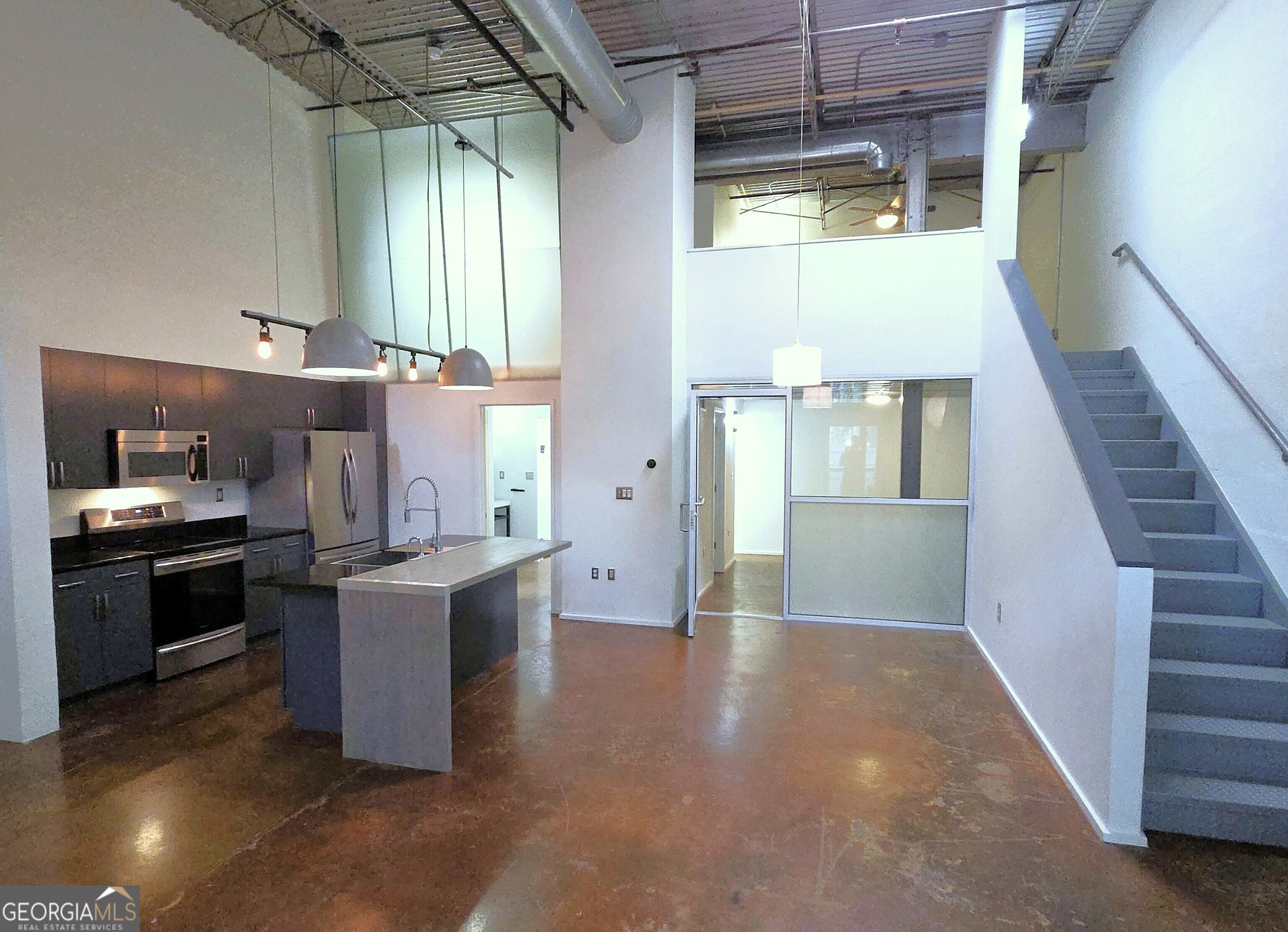 Contemporary Urban social living at its best. Welcome to Arizona Lofts. This is NOT your cookie cutter complex. Many different style units and this is one of the best. This one has two full bedrooms and full baths, basically a double master, great for roommate situation or home office. Bright two story loft with patio area that looks out into this buildings storybook manicured sprawling courtyard. Modern kitchen with granite and contempory stainless appliances. Fridge, washer & dryer are included. Both full baths are full apportioned. Lots of space to design to your needs. The complex is vast and includes numerous social areas inside and out. In this building you have a full fitness complex, rooftop social area and locked mail facility. In building 2 at 130 Arizona, you have access to a large pool, hot tubs, social lounge area, 2nd gym and more. Dog park is part of the complex as well. Right in the heart of east Atlanta convenient to shopping, restaurants, MARTA and with easy access to the interstates. You HAVE to tour this whole complex to truly appreciate the vibe, it can't be beat in Atlanta.
