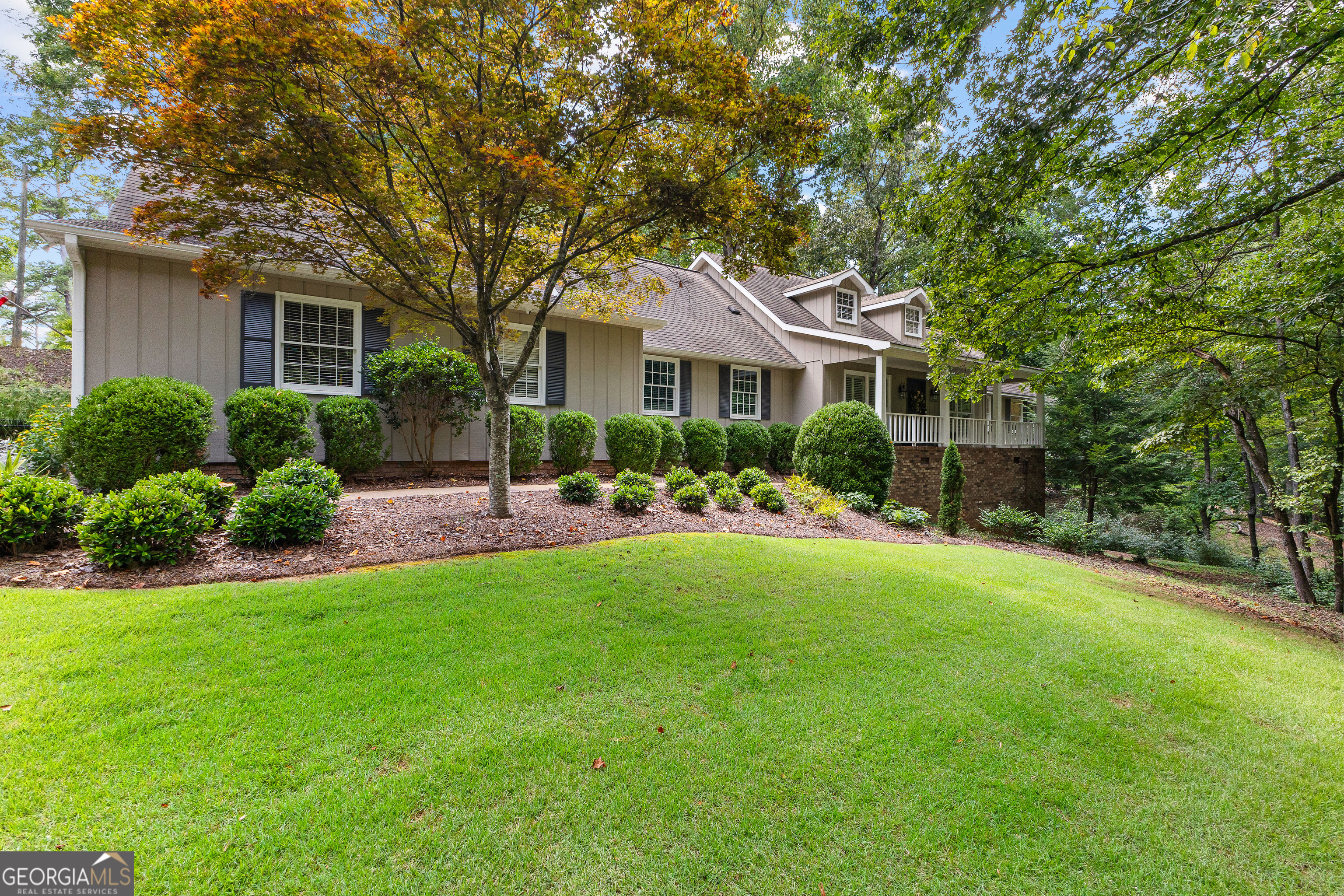 Charming 4-Bedroom, 3-Bath Home on 2.39 Acres in the Sought-After Hollis Hand School District. Tucked away on a private 2.39-acre lot, this beautifully maintained home combines timeless charm with modern updates, offering the perfect balance of comfort, character, and functionality. With 4 spacious bedrooms and 3 full bathrooms-including two bedrooms conveniently located on the main level-this home accommodates a variety of living arrangements. Upstairs, you'll find two additional bedrooms with oversized closets, offering ample storage and flexibility for guests, children, or a home office. Hardwood floors flow throughout the main living areas, while the updated kitchen is a true chef's dream, featuring quartz countertops, a gas cooktop, double oven, pot filler, and a butler's pantry that connects seamlessly to an oversized, custom-designed mudroom with smart storage solutions. The inviting living room showcases rich wood molding, neutral tones, and a cozy gas log fireplace that creates a warm and welcoming atmosphere. Step outside to enjoy both a charming front porch and a screened back porch-perfect for relaxing or entertaining guests. The terraced backyard is beautifully landscaped with a dedicated garden area, and offers the peace and privacy of a serene, natural setting. Additional highlights include a 2-car garage with storage, a basement ideal for a home gym, workshop, or additional living space. Beautiful and thoughtful updates throughout the home. Located in the highly desirable Hollis Hand School District, this property is a rare find-offering space, privacy, and upscale finishes in a truly beautiful setting.