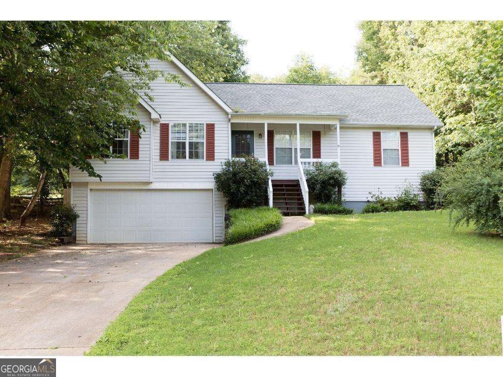 Immaculate ranch on full basement. Hardwood floors thru-out. Split bedroom plan, cathedral ceilings in great room and master suite. Huge unfinished basement ideal for workshop and tons of storage. Private fenced backyard with deck, rocking chair front porch, excellent location within one mile of GA 400 and exit 16.