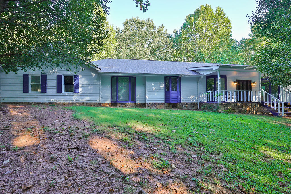 Spacious and Open Ranch Home on 1.52 Acres in Cumming, Fantastic Location- Walking Distance to the New Cumming City Center! Open floorplan with Huge U-Shaped Kitchen, Beautiful Solid Stained Wood Cabinetry, Large Island, Newer LVP Flooring, Open to Family Room with Vaulted Beamed Ceiling, Stone Fireplace. Separate Dining Room Open to the Kitchen. Front Foyer, Solid Wood Entry Door with wide Sidlites. Master Suite with Sitting Area, Walk-in Closet with Custom Closet Shelving. Master Bathroom with Tile Floor, New Vanity, and Large Stand Up Shower with Tile to the Ceiling. Second Master Bedroom with Huge Walk-in Closest has Custom California Style Closet System with Shelves and Generous Hanging Space, Master II Bathroom Features Tile Floors, Long Vanity, Double Sinks, Separate Shower, and Jetted Tub. Large Laundry Room with Generous Cabinetry and Folding Space Counter Top. Covered Back Patio and Front Porch, Large Back Yard. Large 2 Car Garage with additional Workshop and an Additional Shed in the Back Yard. No HOA/ no Rental restrictions. Private but Close to Shopping, Schools and everything.