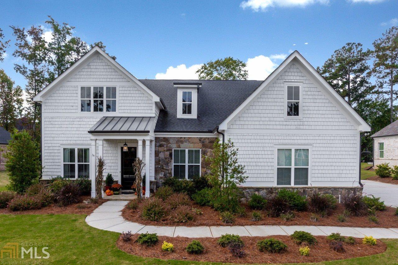 Farmhouse Ranch style home tucked away in East Cobb. This perfectly appointed home is set in the middle of beautiful $1M+ homes. Enjoy this quiet haven that is oh so close to all of East Cobb and Roswell amenities. You will not have to do anything but move in and enjoy the quiet backyard overlooking mature trees. This home features a generous sized master suite on the main level along with three other sizable bedrooms and adjoining bathrooms. The kitchen is a cook's dream with farmhouse sink, massive pantry, and beautifully designed cabinets. Perfect for entertaining, the kitchen opens to the living room which has magazine worthy built-ins, shiplap, and lighting. There are too many features to list, it's a must see.