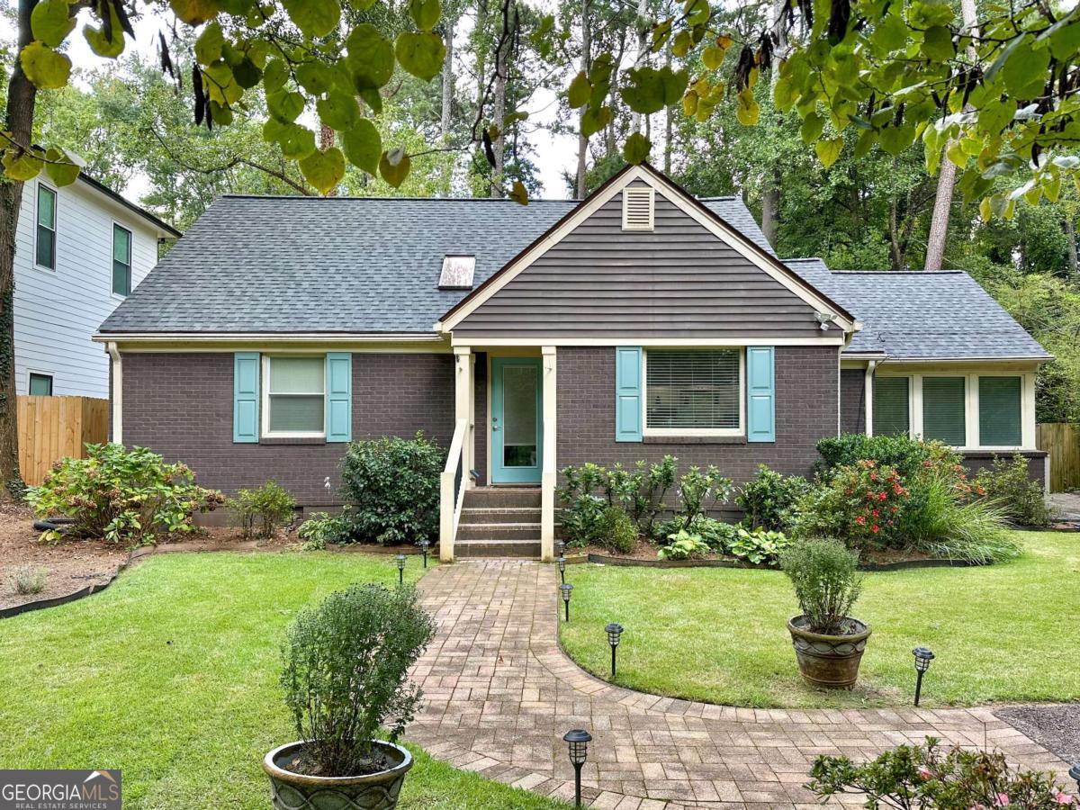 Many thoughtful upgrades over the last year including most recently a new roof and new AC unit. 2567 Midway Road offers a thoughtful blend of comfort, connection, and convenience in the heart of Midway Woods-one of Decatur's most welcoming and walkable neighborhoods. With sidewalks, streetlights, and a community park just down the street, it's the kind of place where neighbors stop to chat and keep an eye out for one another. The open-concept layout on the main level creates a sense of ease and flow-light-filled, airy, and comfortable. The kitchen is bright and inviting, with granite counters, an island, and space that naturally draws people together. A cheerful sunroom adds a flexible space that feels calm and uplifting throughout the day, while the screened-in patio extends living outdoors-ideal for enjoying a book, a quiet breeze, or hosting friends for game nights or music under the ceiling fans. With four bedrooms, including a main-level primary suite with custom walk-in closet, there's room to grow and spread out. The back and front yards are beautiful and lovingly manicured. The backyard is fenced and very private making it the perfect place for entertaining, gardening or simply relaxing. Practical updates like a tankless water heater, encapsulated crawl space, and a separate storage shed round out the home's features. Located just minutes from downtown Decatur, Oakhurst Village, Emory, and the Avondale MARTA station, this address offers easy access to restaurants, parks, schools, and everything in between-while still feeling like a quiet retreat. 2567 Midway Road is a place where comfort meets community-a solid, well-loved home in a neighborhood that truly feels like home.