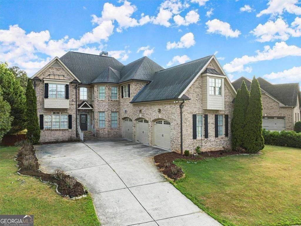 Experience the luxury of spacious living and income-generating opportunities at this stunning brick home, nestled in the sought-after subdivision of Registry at Old Lost Mountain. This freshly painted home offers both comfort and modern amenities, including a cozy double-sided fireplace, a bedroom and full bath on the main floor ideal for guests or multi-generational living, dedicated office space, a formal dining room, and two living areas. The huge kitchen features stainless steel appliances, granite countertops, a double oven, and a massive island that opens to the breakfast area and second living area. The second floor boasts an expansive master bedroom with sitting area, a luxurious master bath with his/her vanities, a separate tub and shower, an enormous master closet. Second floor as features a dedicated movie room or loft space for entertainment. Each bedroom has immediate access to a bathroom for exceptional convenience. Additional amenities include two brand new HVAC systems, smart lawn sprinklers, and a full, finished in-law suite basement complete with two bedrooms, full bath, full kitchen, living room, dining room, office, and storage room. The accessible entrance with a ramp in the three-car garage, level lot with a fenced-in backyard, and fantastic screened-in porch enhance outdoor living. Located in a well-kept, quiet neighborhood with amenities including a swimming pool, tennis courts, and a clubhouse. This home is in a prime location close to shopping, entertainment, restaurants, and schools, and just minutes from Truist Park, home of the Atlanta Braves, and The Battery entertainment district, as well as near Fox Creek Golf Course and Driving Range, the Silver Comet Trail, and much more. This home truly offers it all; don't miss the chance to make it yours and enjoy both luxurious living and prime convenience!