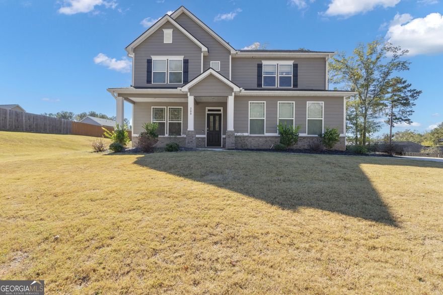 Welcome to 200 Darien Drive in Senoia's Heritage Pointe! This beautiful two-story home, built in 2022, features an open-concept layout with hardwood floors, a spacious family room, and a gourmet kitchen with granite counters, stainless steel appliances, double ovens, and both a butler's and walk-in pantry. The main level also offers a guest bedroom and full bath.  Upstairs you'll find a large owner's suite with a sitting area and spa-like bath, plus generous secondary bedrooms and a media room/office area.    Enjoy outdoor living on the covered patio with ceiling fans and BBQ area, and take advantage of the community's amenities-swim, tennis, basketball, fitness center, clubhouse, and more. Golf cart accessible to Downtown Senoia and just minutes from Peachtree City, this home blends comfort, convenience, and community perfectly.
