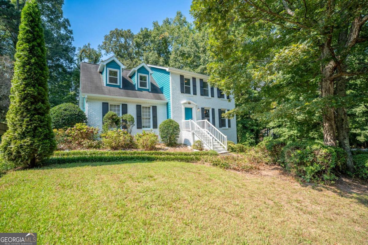Ideally located just minutes from Highway 78, Scenic Highway, and Stone Mountain Park, this spacious 4-bedroom, 2.5-bathroom home blends comfort and potential in a prime location. Inside, the main level features a cozy living room with a fireplace, a separate dining room, and a kitchen equipped with BRAND NEW APPLIANCES AND FRESH NEW PAINT. Outside enjoy a back deck, perfect for relaxing or entertaining and a large backyard. Upstairs, the primary ensuite offers a soaking tub, separate shower, and ample closet space. All bedrooms are generously sized to suit a variety of needs. The unfinished basement-with both interior and exterior access-presents a fantastic opportunity to add value and customize to your lifestyle. Don't miss your chance to own a home with space, charm, and future potential in a sought-after location. Discounted rate options and no lender fee future refinancing may be available for qualified buyers of this home.